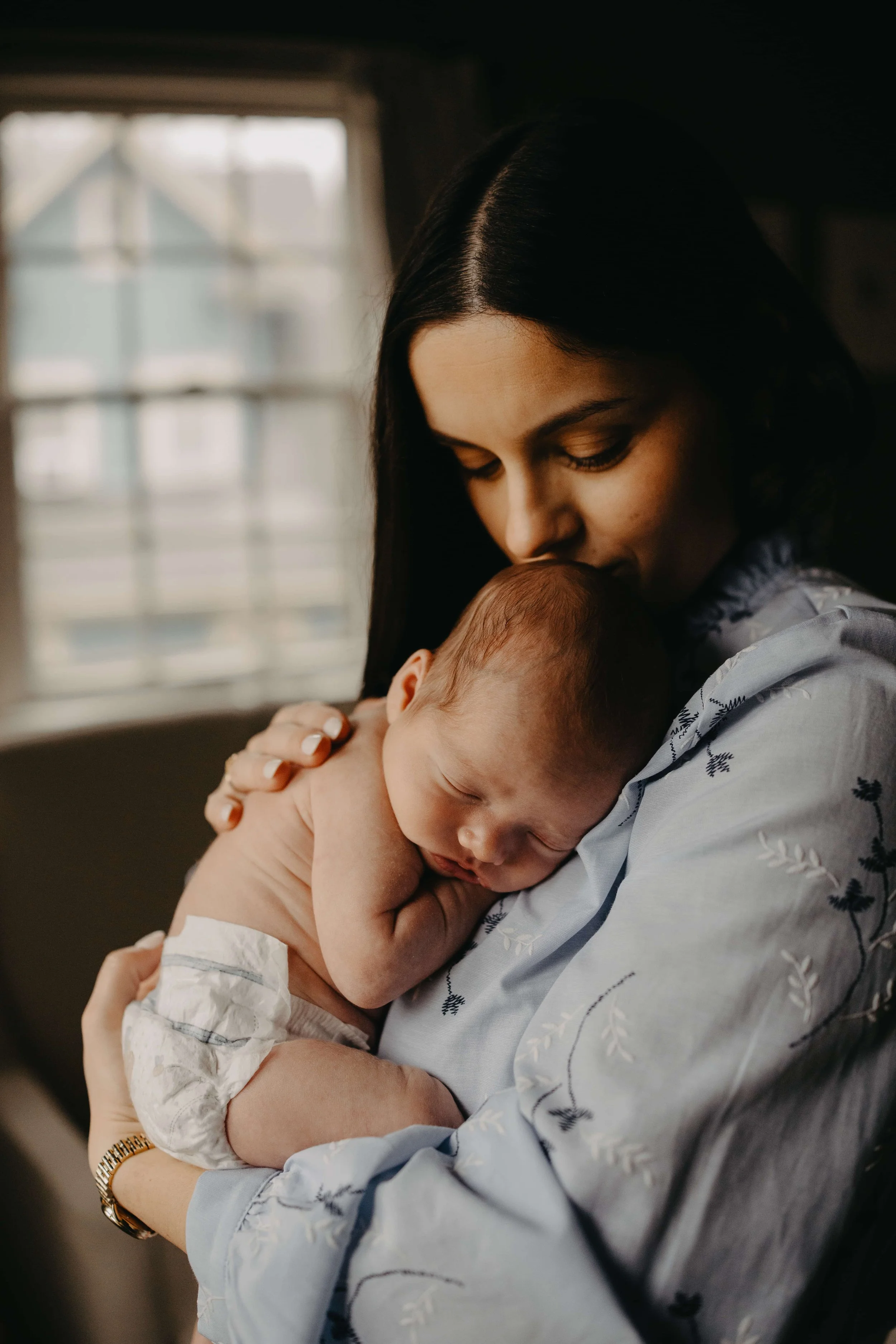 Cleveland family with newborn during in-home photography session