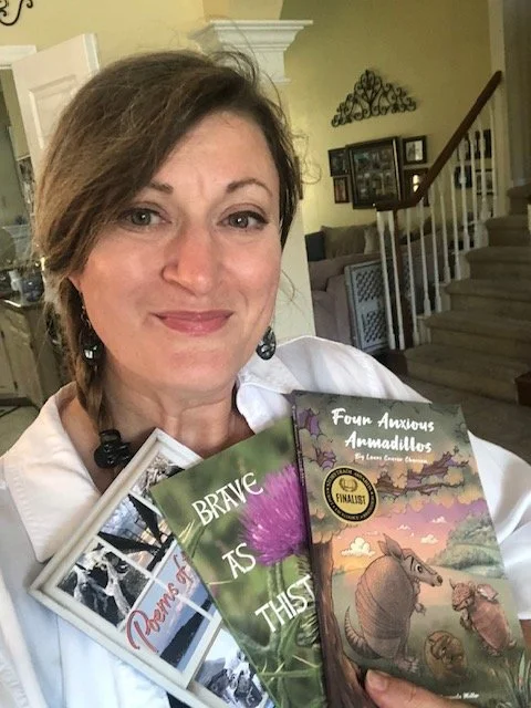 all three book pic with author.jpg