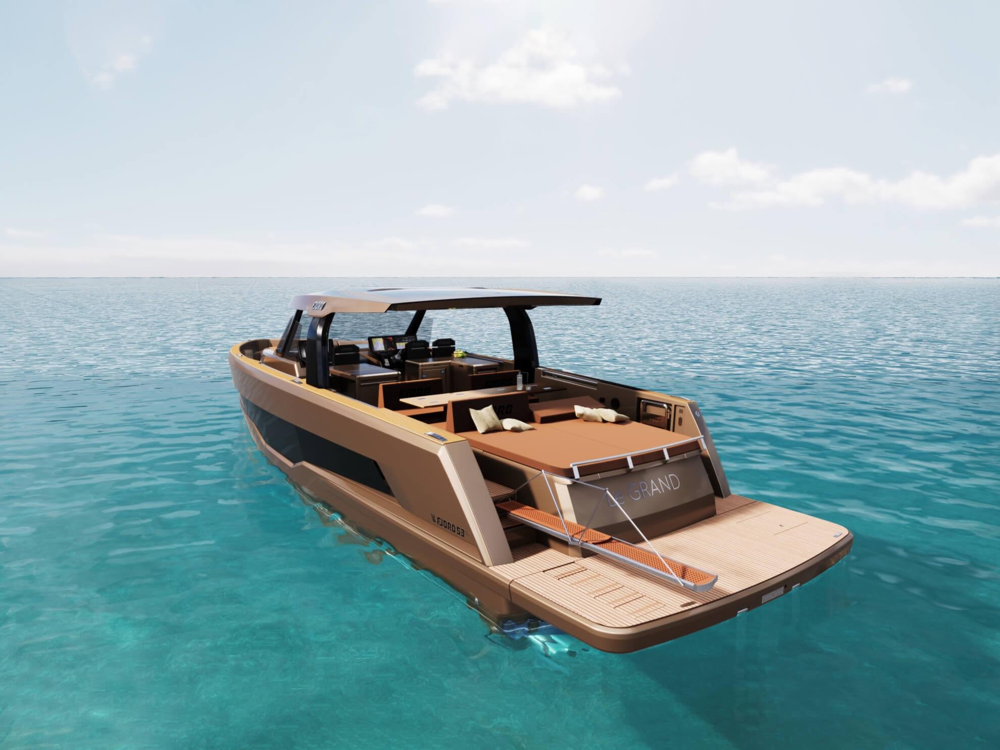 A luxury motor yacht floating on calm ocean waters under a partly cloudy sky.