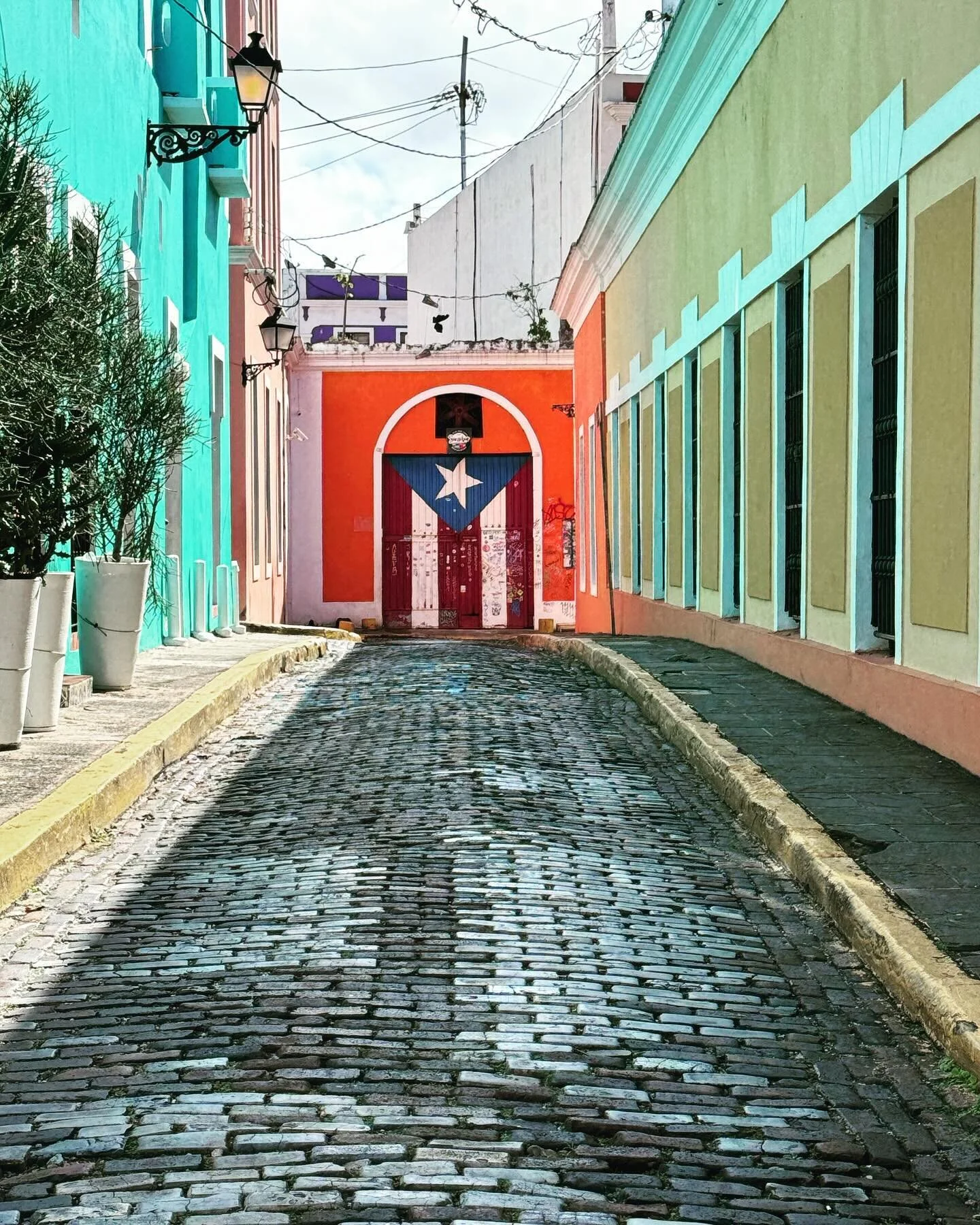 Step into a world where vibrant colors dance on every street corner, where history whispers through the cobblestone pathways, and where architecture tells tales of a rich and diverse past. 
Welcome to Old Town San Juan, the pulsating soul of Puerto