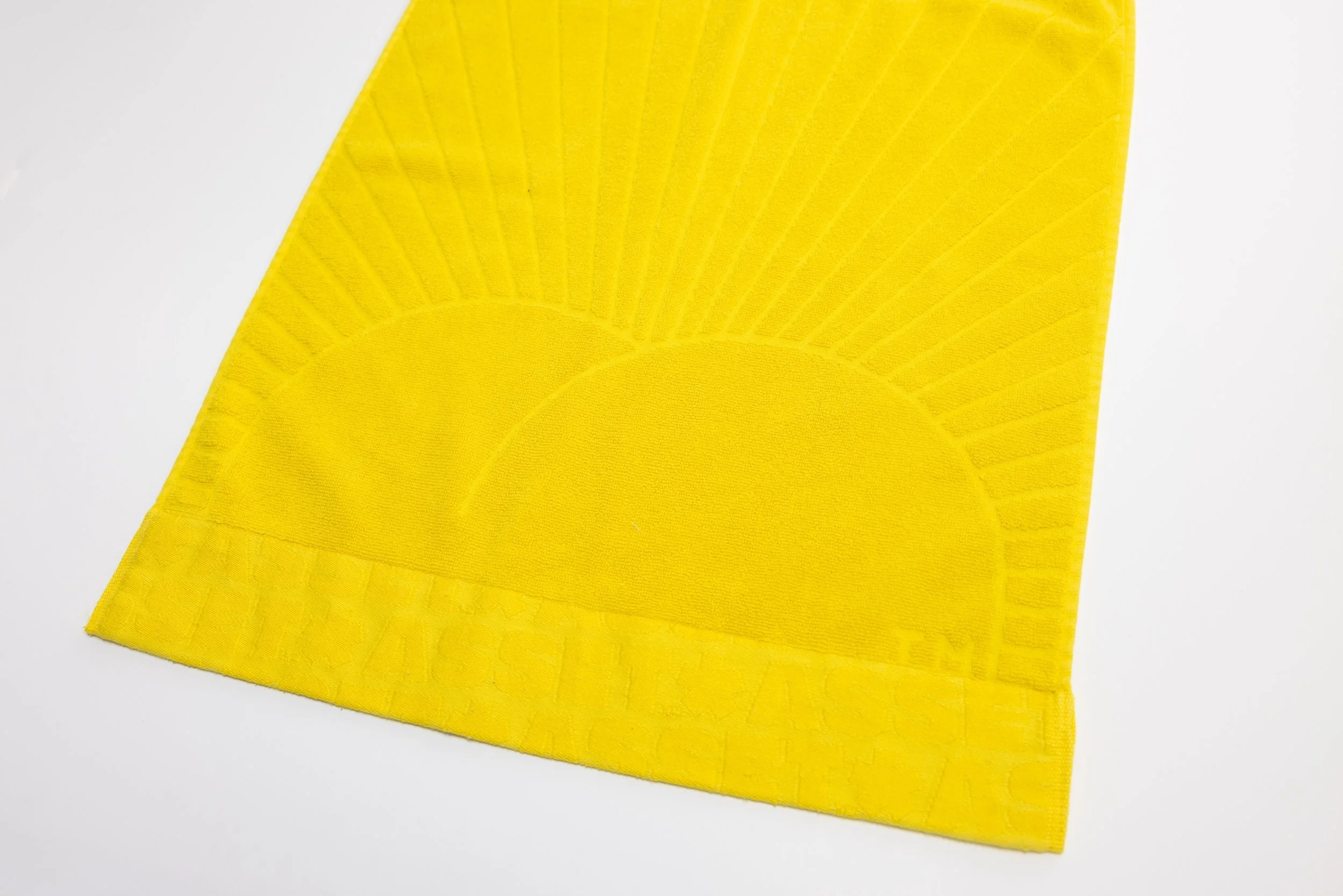 Yellow hand towel product photography in a studio by Portland, Oregon product photographer, JP Bogan. PDX Product Photography at SumSum Productions studio.
