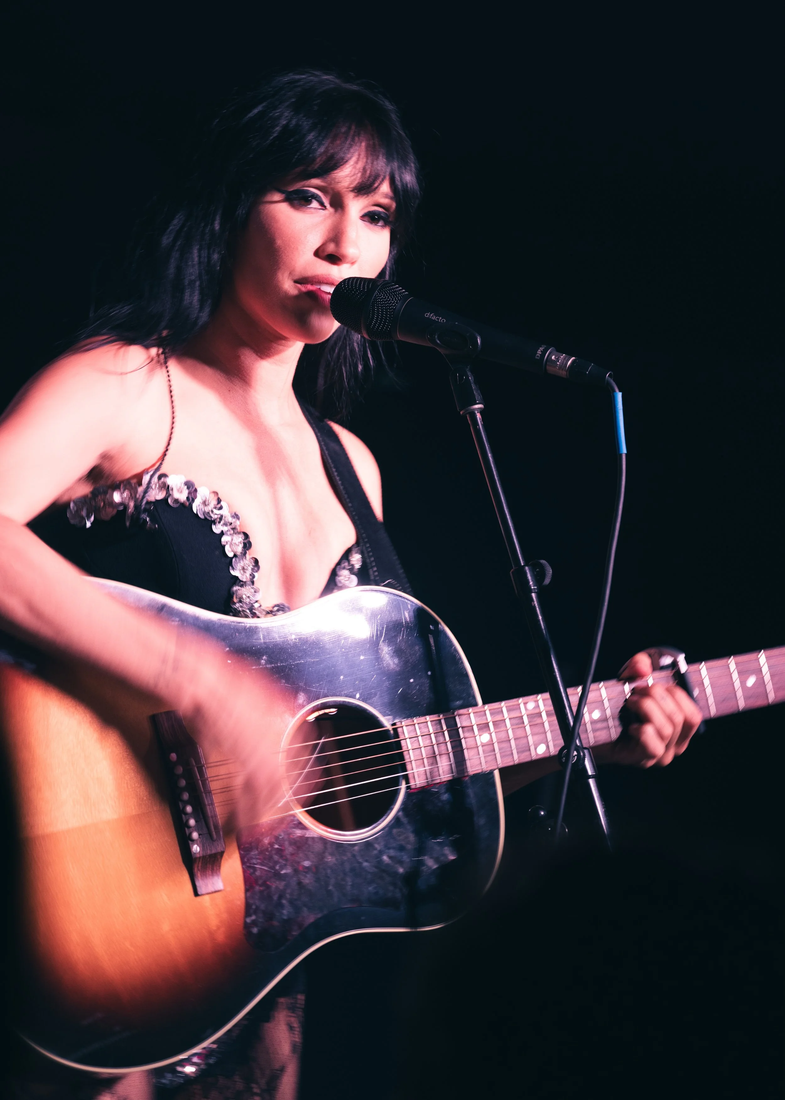 Concert photo of Syd Taylor performing on acoustic guitar at The Get Down music venue in Portland, OR. 