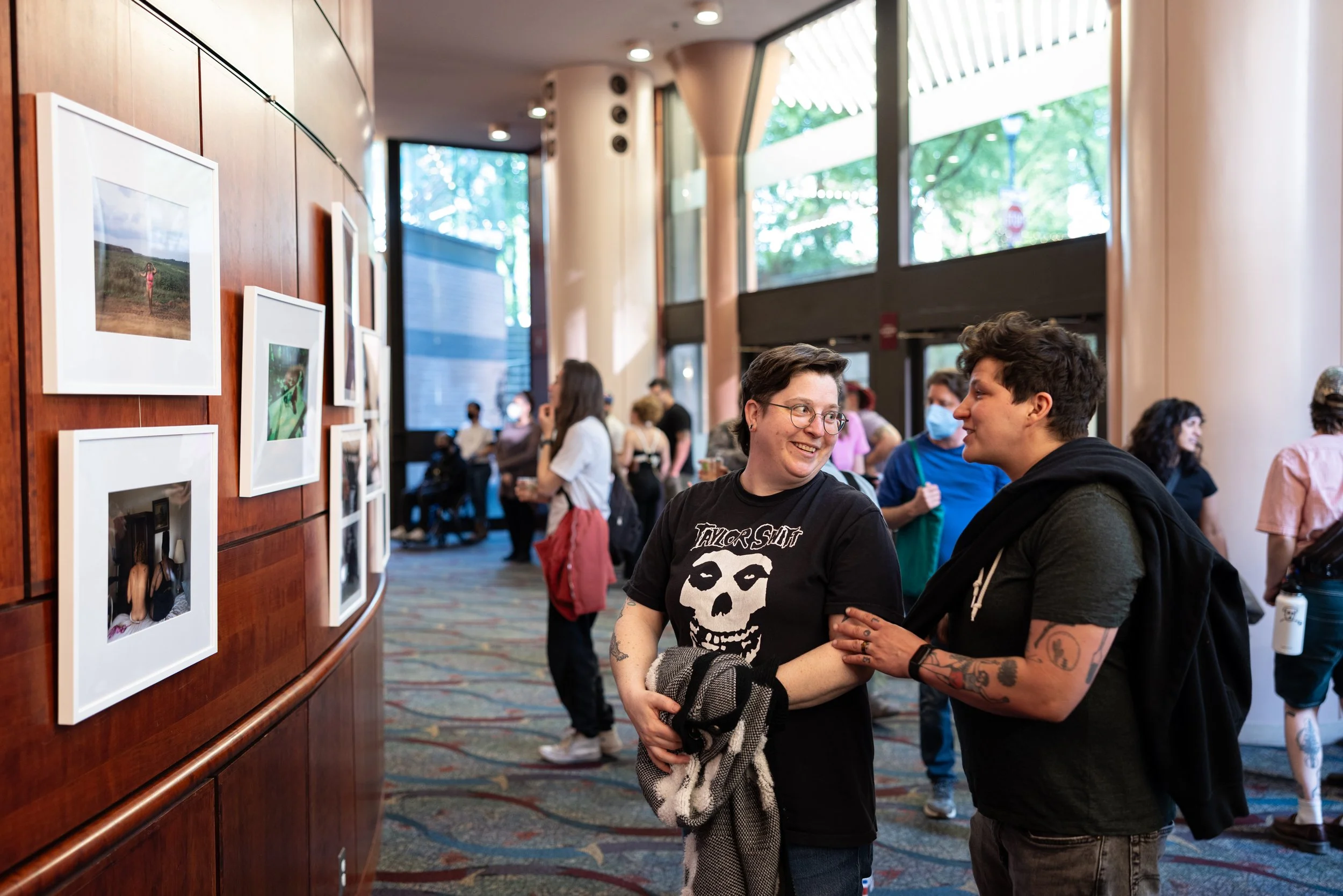 People chatting at exhibition at Framing Our Presence event at Portland 5 Winningstad Theater in Portland, Oregon. Event Photography bu JP Bogan.