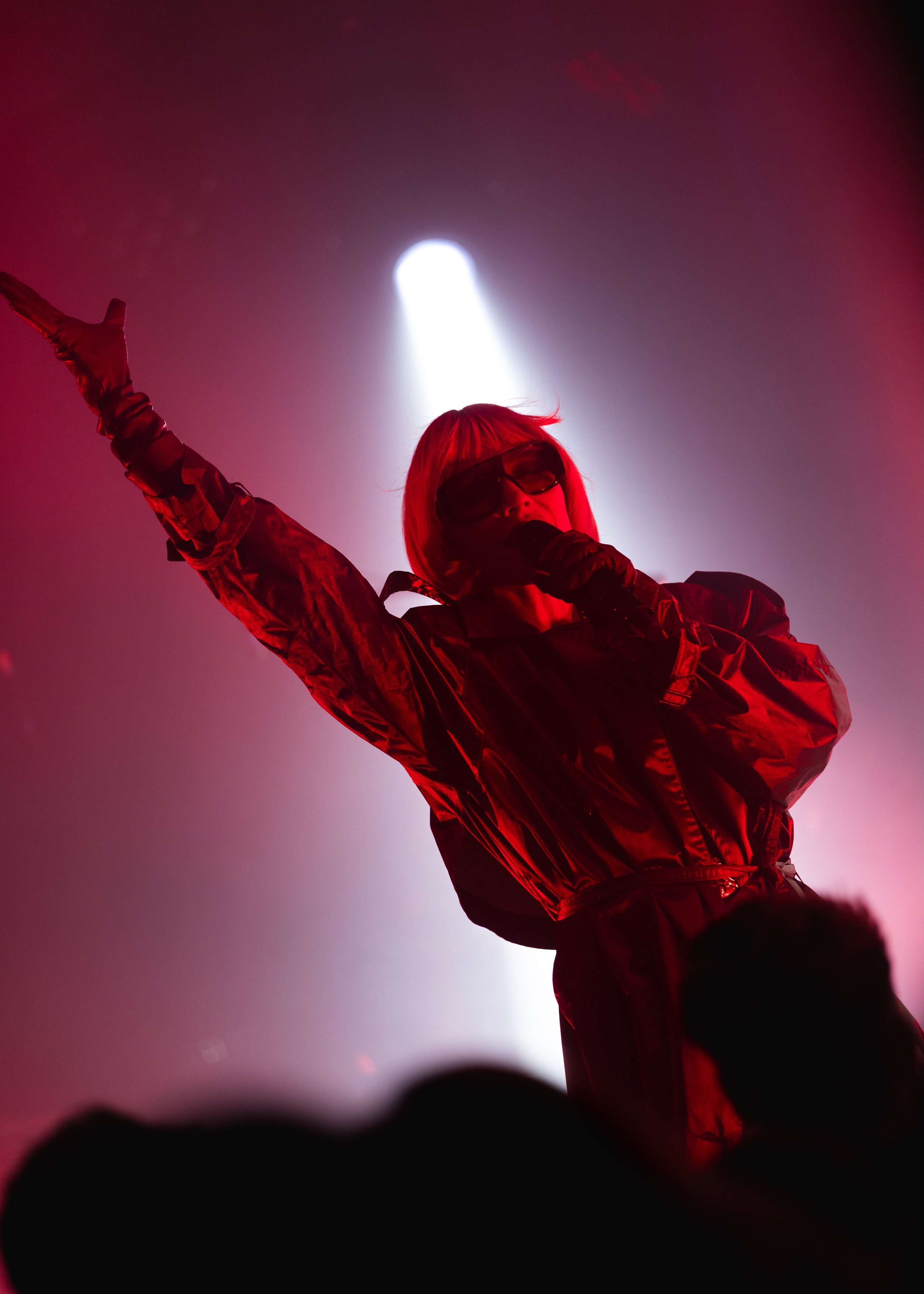 Concert photography of Goldie Boutilier surrounded by red fog and lighting performing on stage at The Get Down music venue in Portland, OR. 