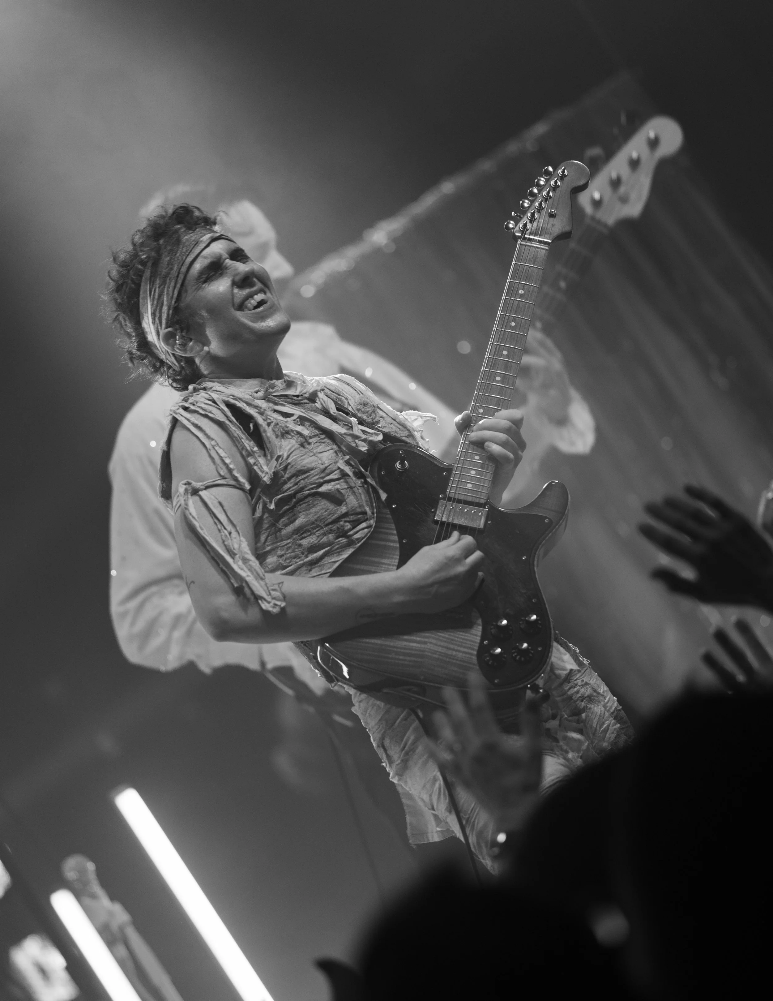 Concert photography of Glitterfox guitar player at Aladdin Theater in Portland, Oregon on Halloween night in 2025.