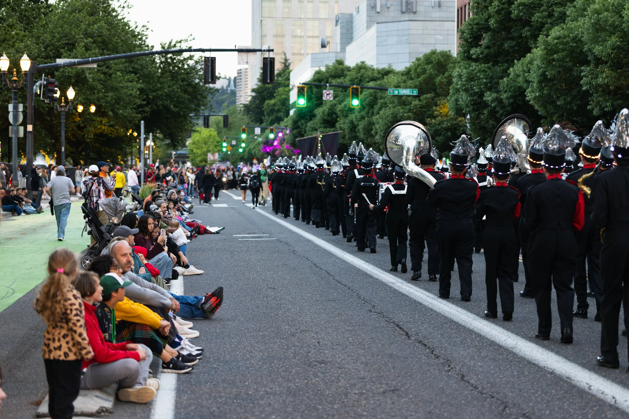 People watching the marching bands in the Starlight Parade in Portland, OR.