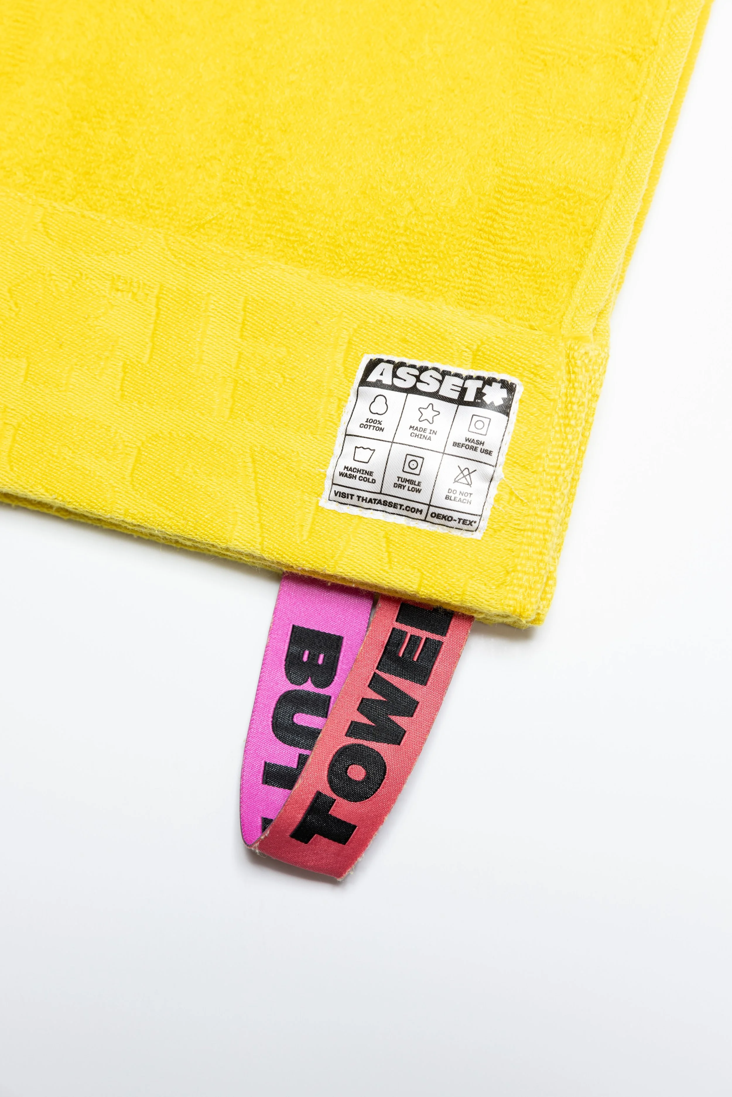 Yellow butt towel product photography in a studio by Portland, Oregon product photographer, JP Bogan. PDX Product Photography at SumSum Productions studio.