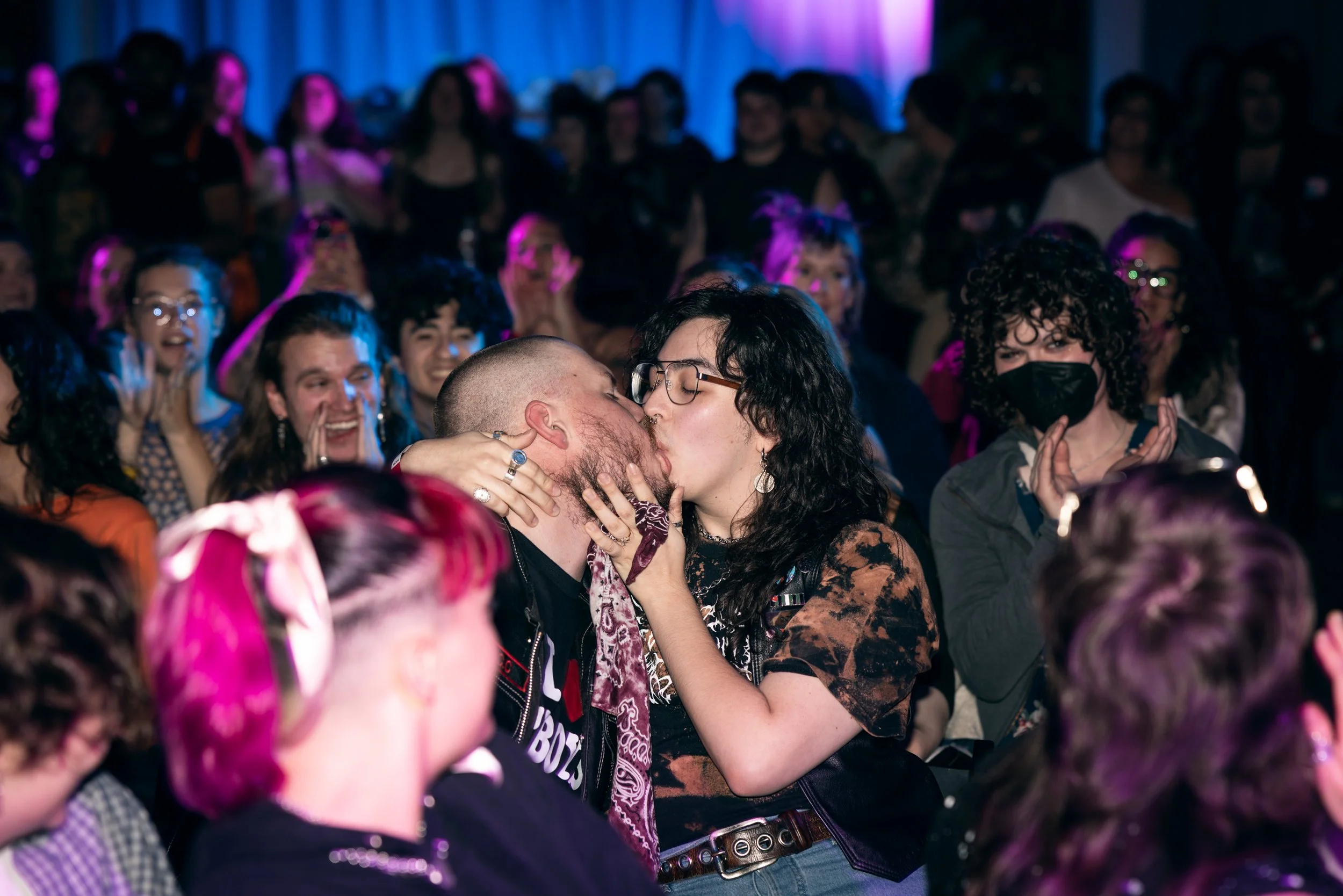 Guests at TBOY Wrestling in Portland, OR kissing in front of the crowd.
