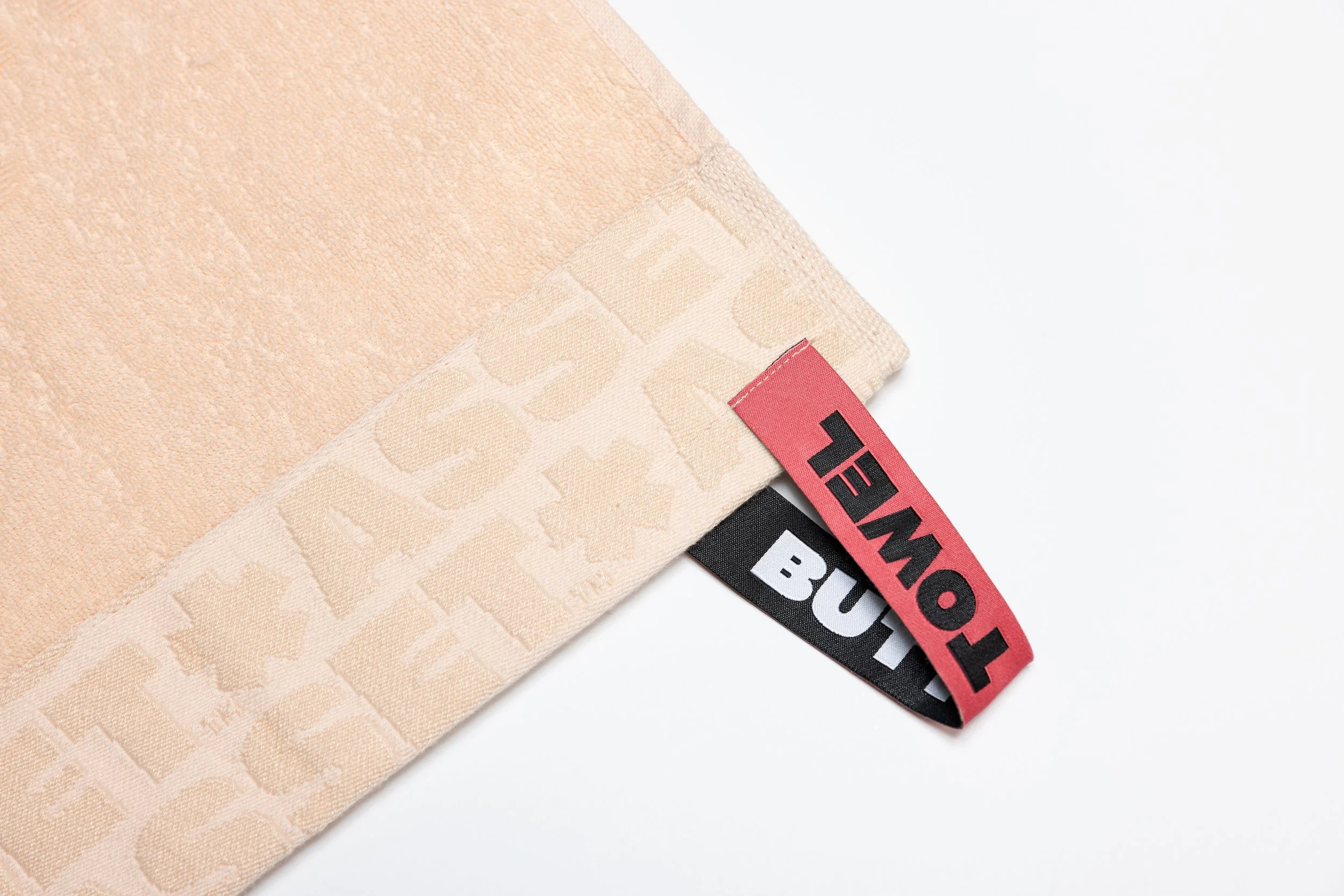 Peach butt towel product photography in a studio by Portland, Oregon product photographer, JP Bogan. PDX Product Photography at SumSum Productions studio.