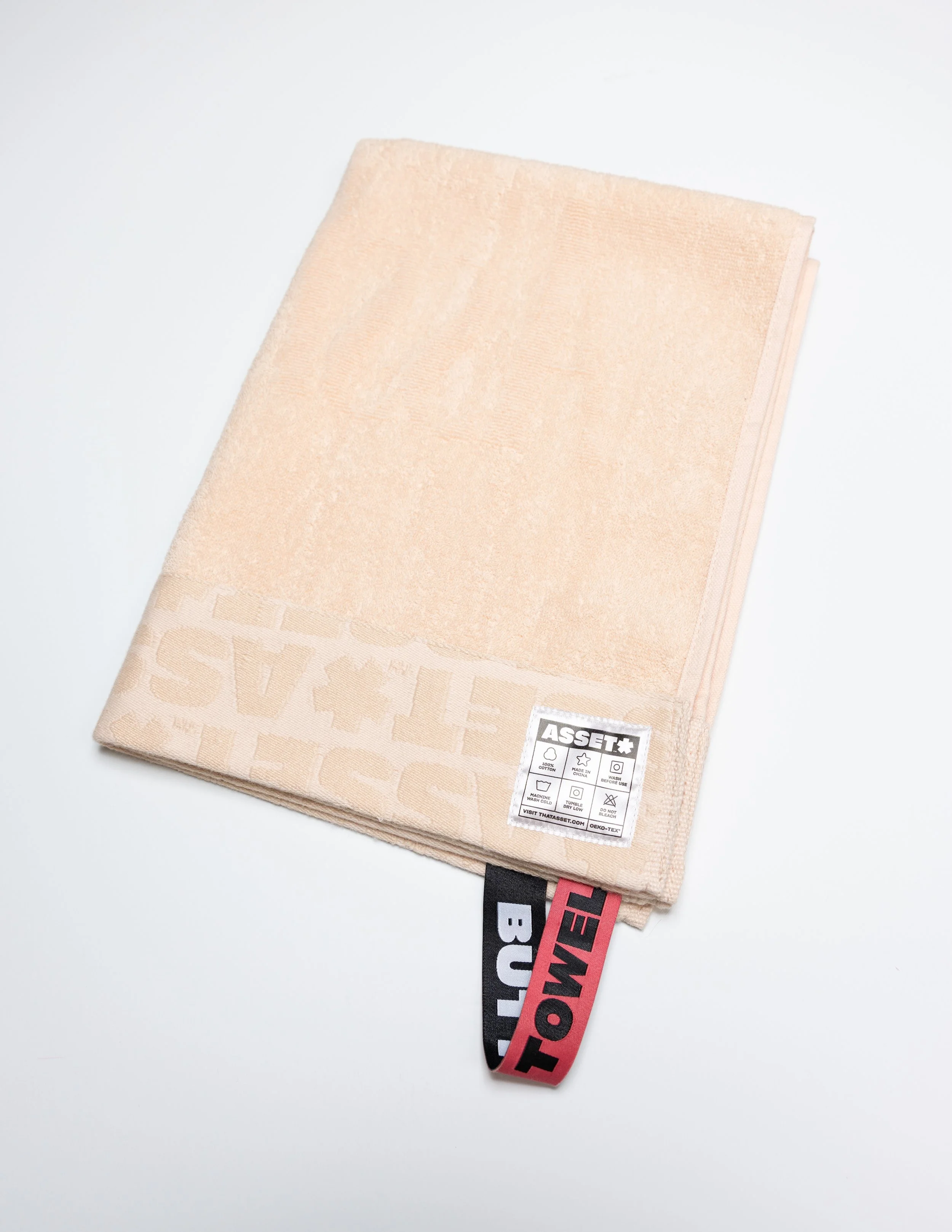 Peach butt towel product photography in a studio by Portland, Oregon product photographer, JP Bogan. PDX Product Photography at SumSum Productions studio.