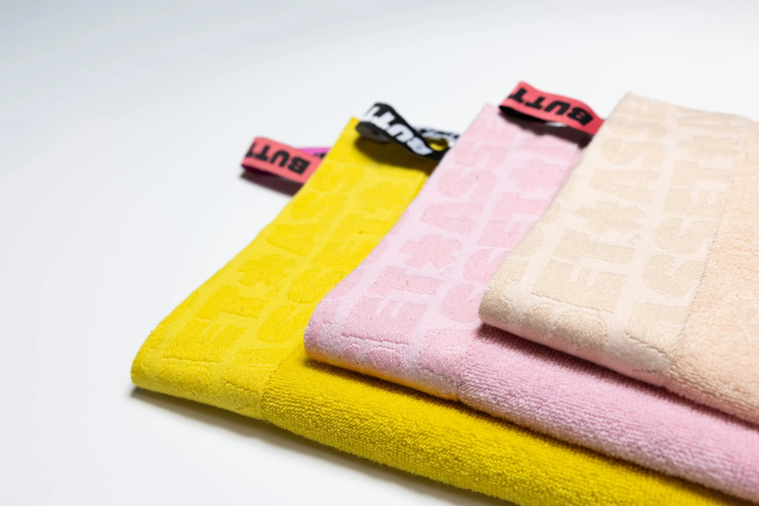 Colorful towels product photography in a studio by Portland, Oregon product photographer, JP Bogan. PDX Product Photography at SumSum Productions studio.