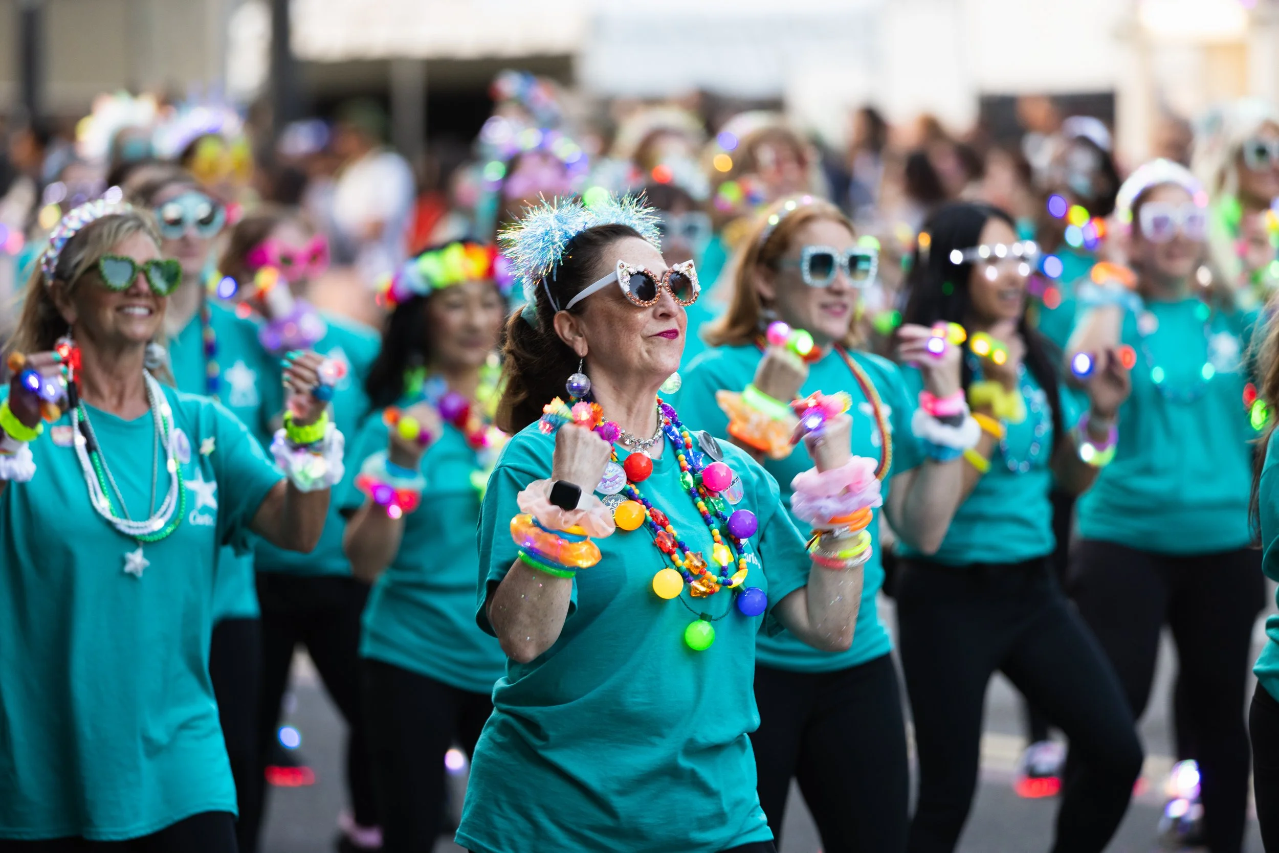 Ladies in sunglasses dancing in the Starlight Parade in Portland, OR.