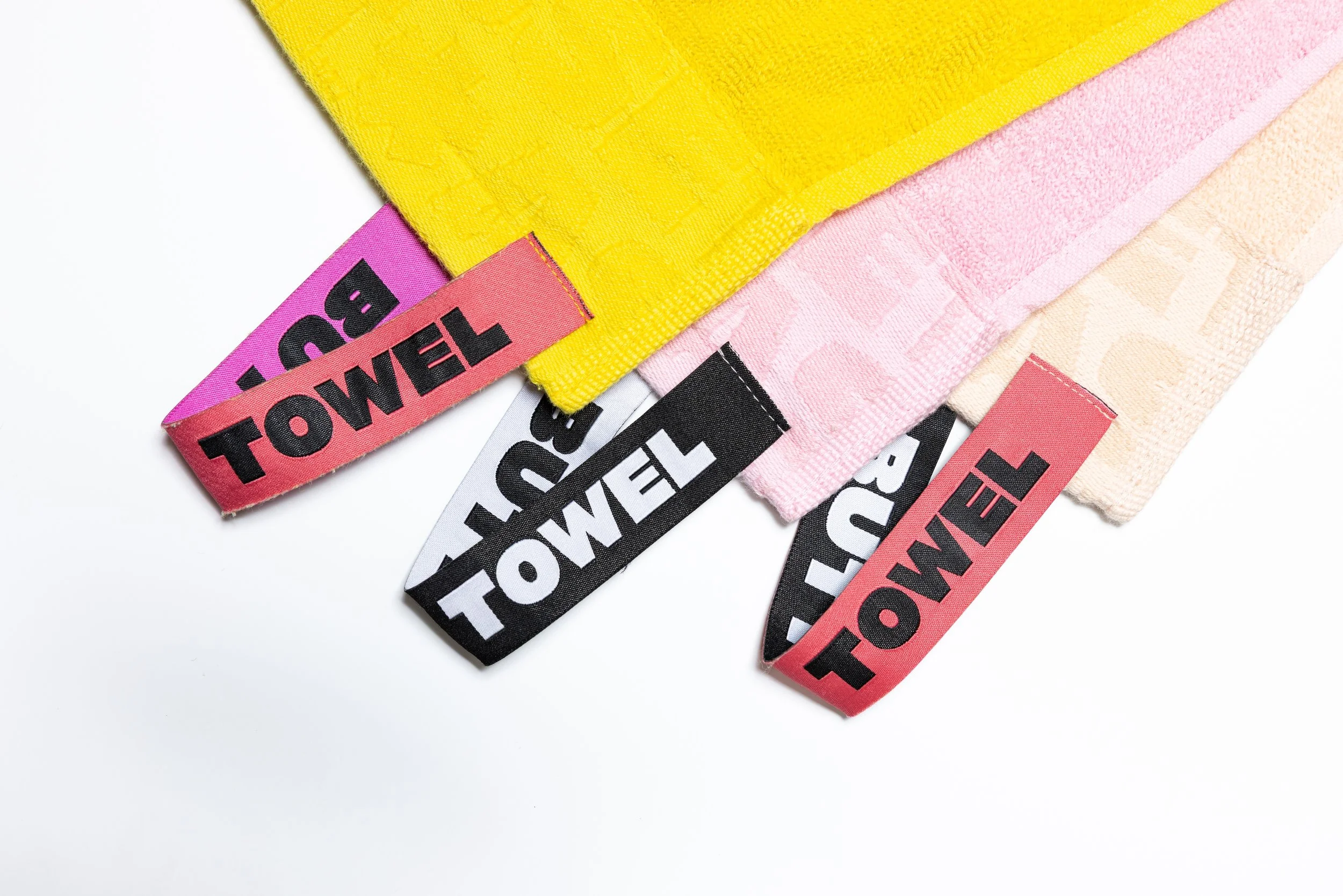 Colorful towels product photography in a studio by Portland, Oregon product photographer, JP Bogan. PDX Product Photography at SumSum Productions studio.