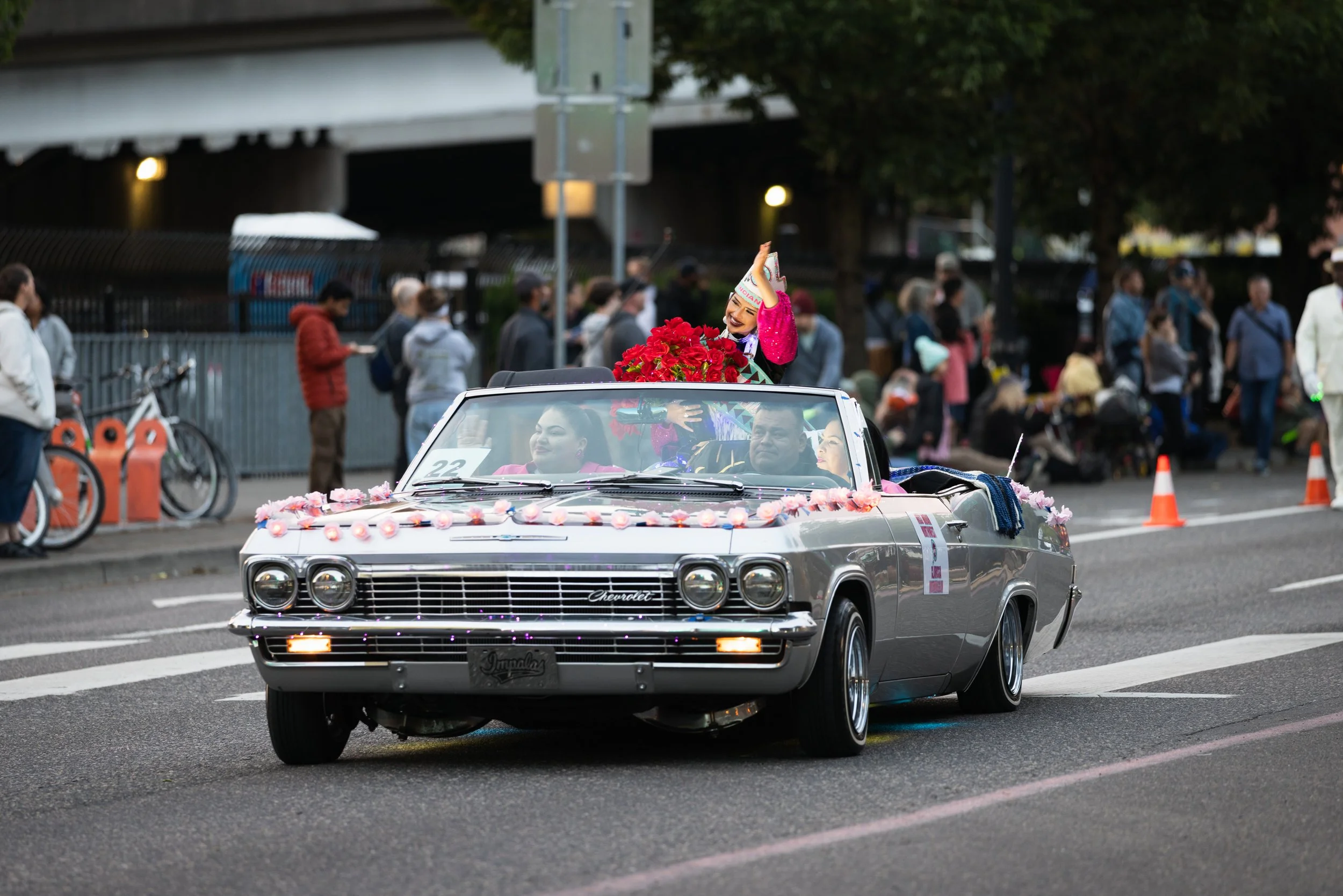 A low rider convertible driving in the Starlight Parade in Portland, OR.