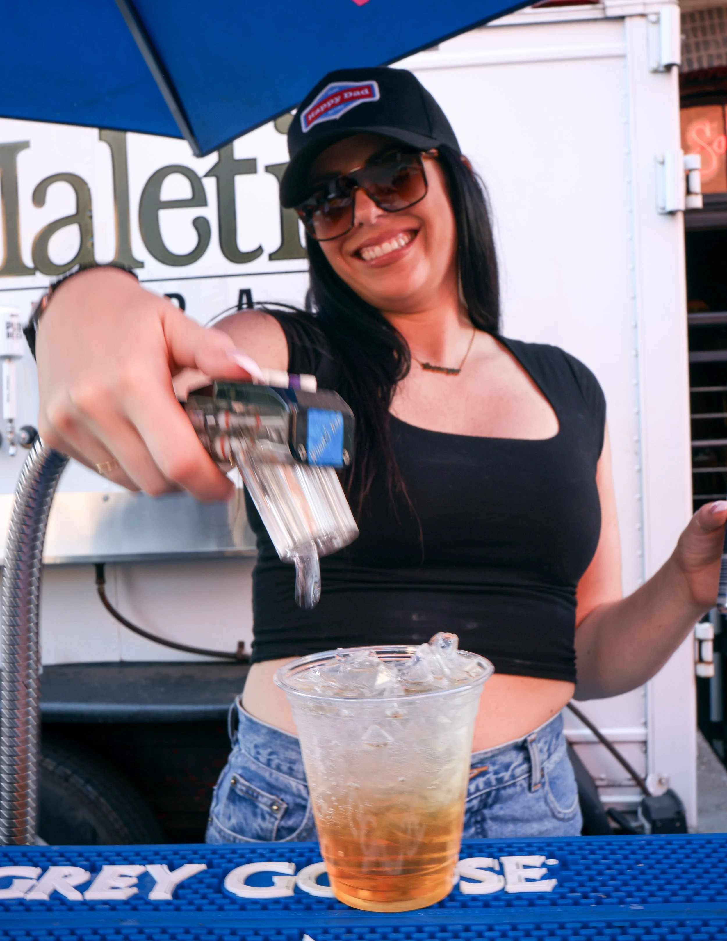 A bartender making a drink at the Pearl Summer Party in downtown Portland, OR.