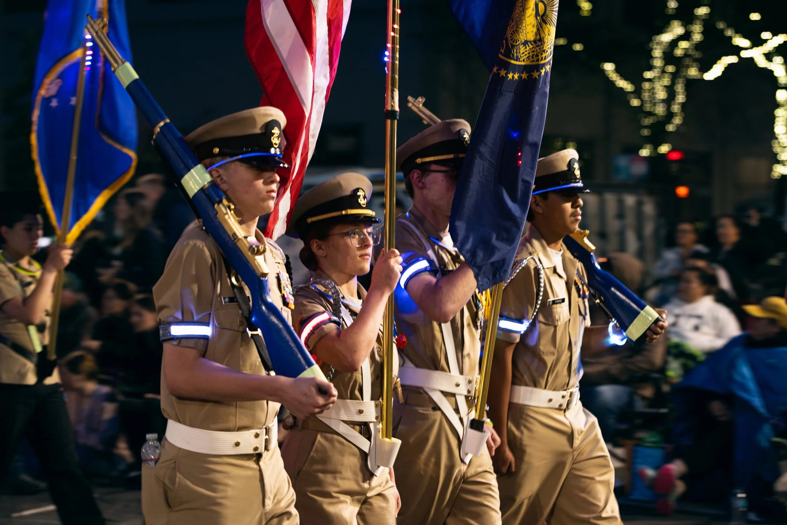 Young ROTC members carrying flags in the Starlight Parade in Portland, OR.