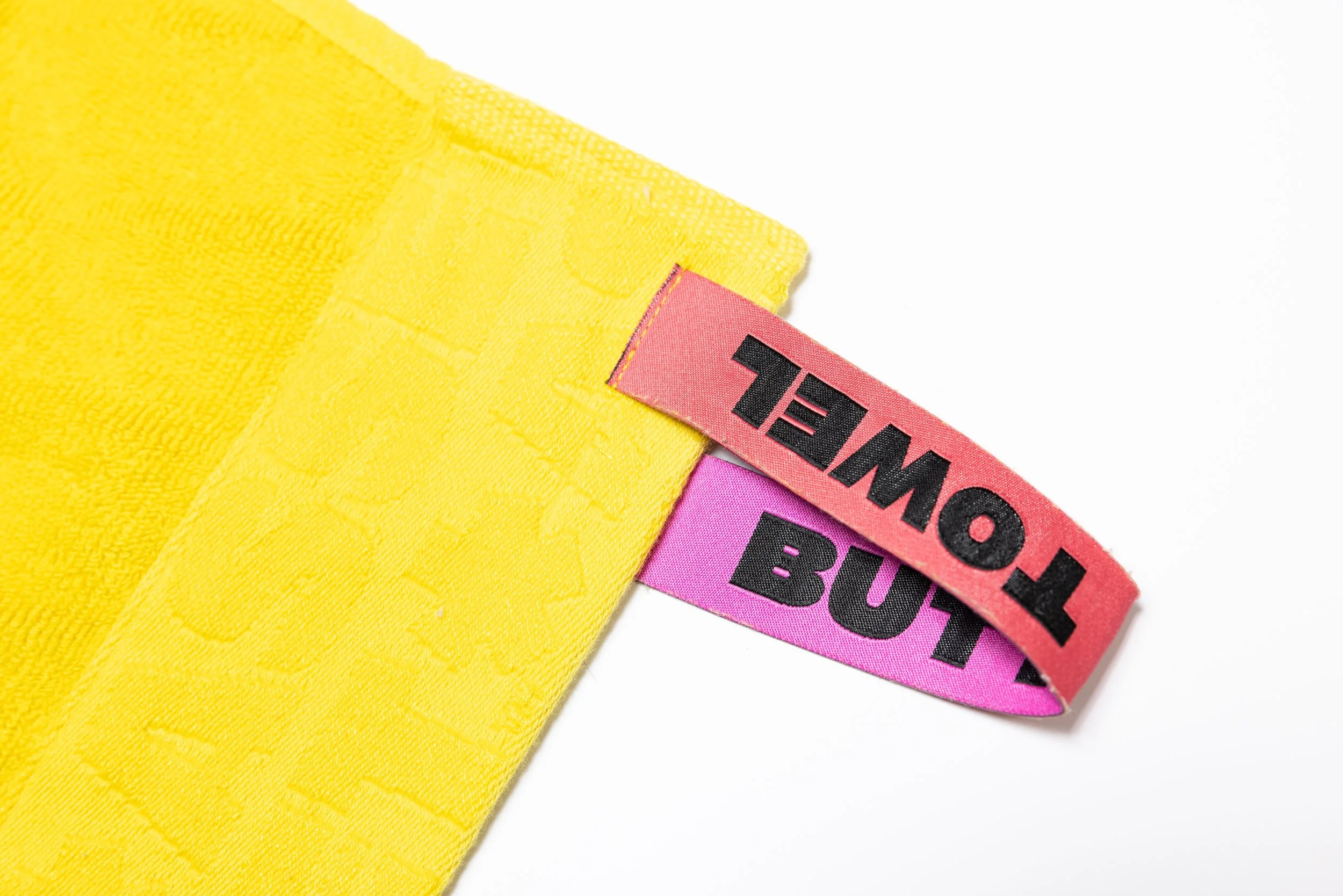 Yellow hand towel product photography in a studio by Portland, Oregon product photographer, JP Bogan. PDX Product Photography at SumSum Productions studio.