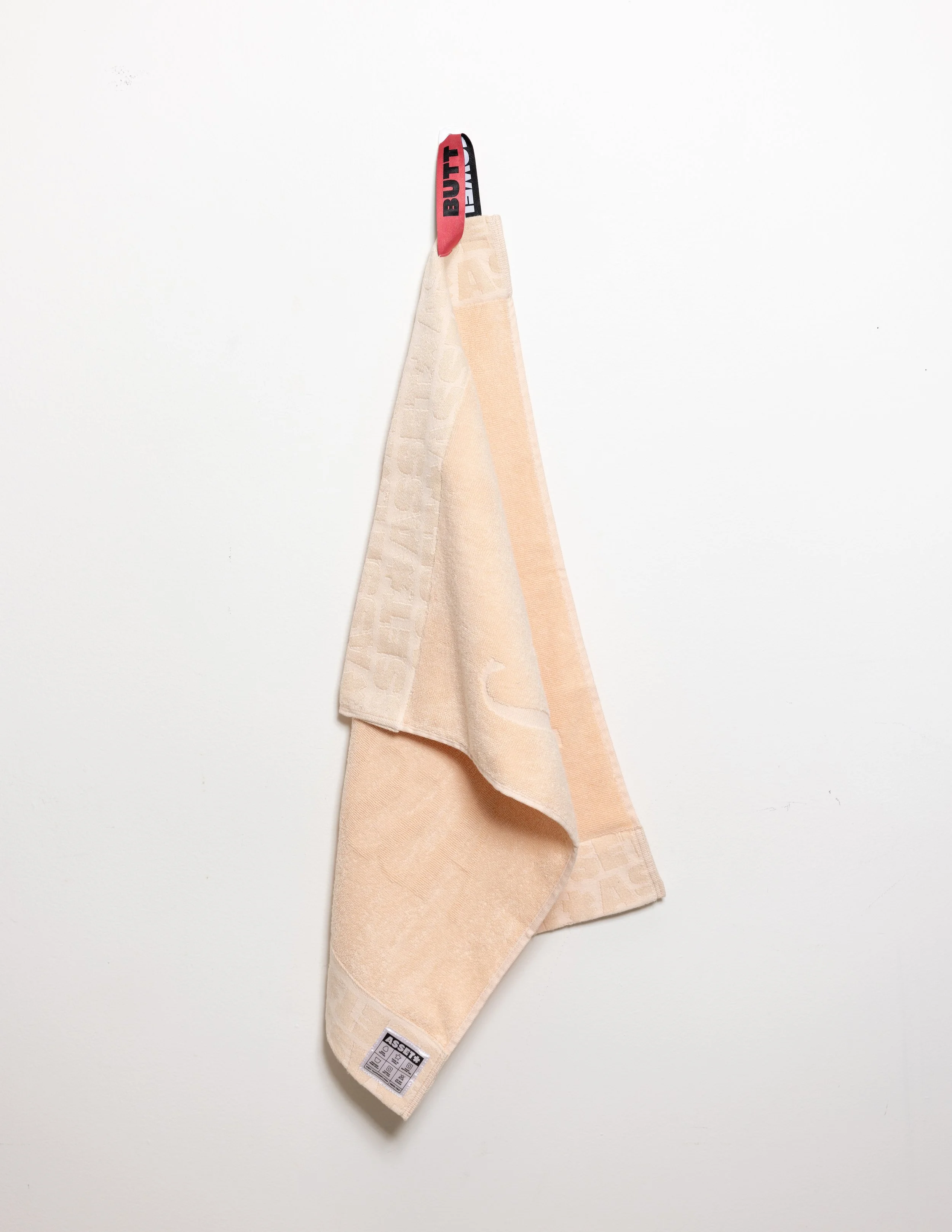 Peach hand towel product photography in a studio by Portland, Oregon product photographer, JP Bogan. PDX Product Photography at SumSum Productions studio.