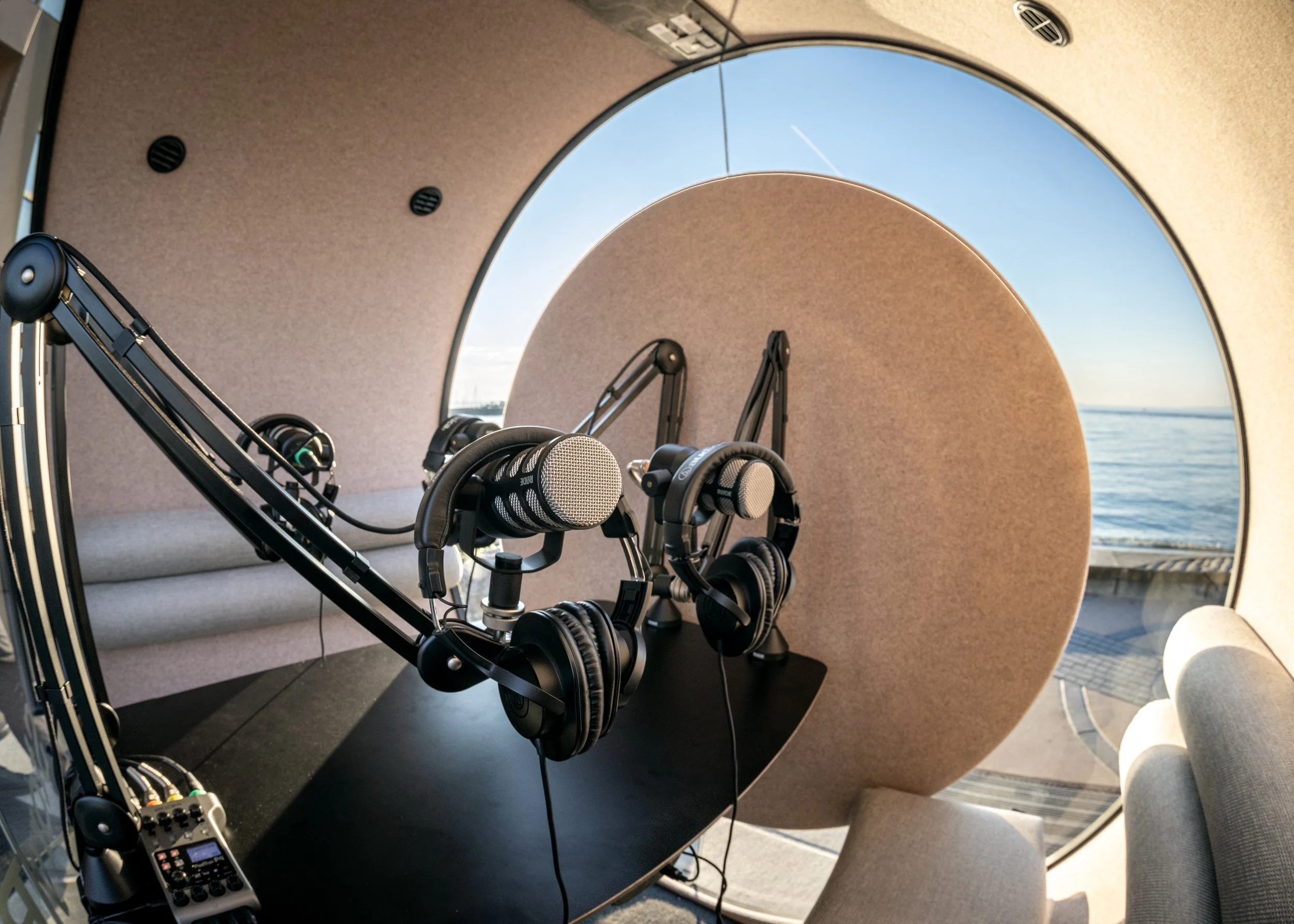 Microphones inside a circular podcast booth. Story Booth Experience product photography at a wedding in Seattle.