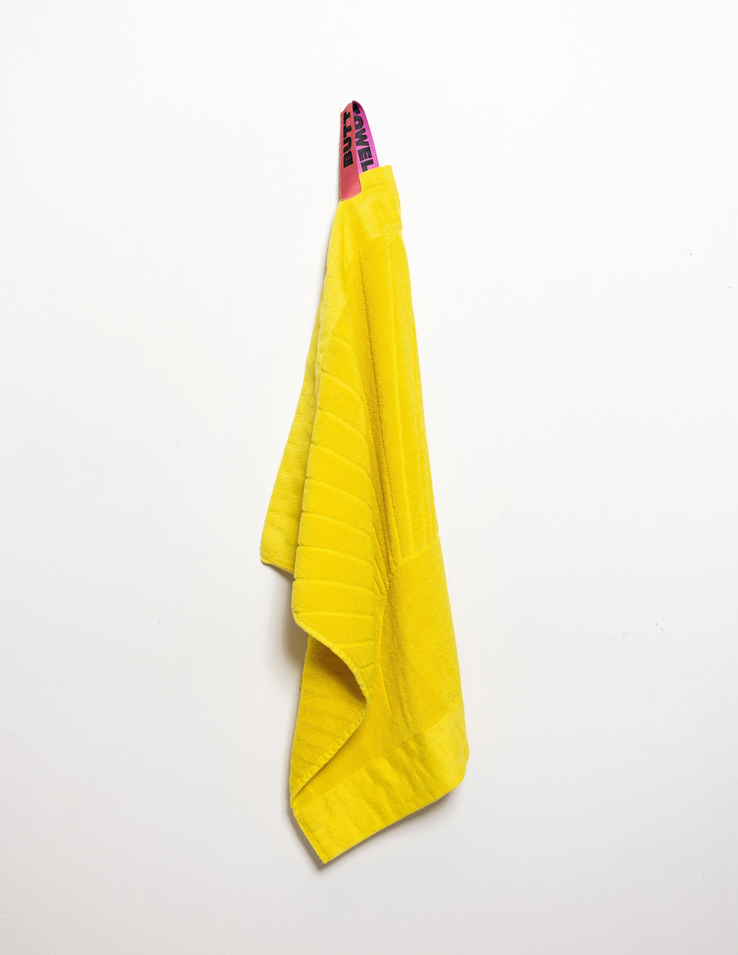 Yellow hand towel product photography in a studio by Portland, Oregon product photographer, JP Bogan. PDX Product Photography at SumSum Productions studio.