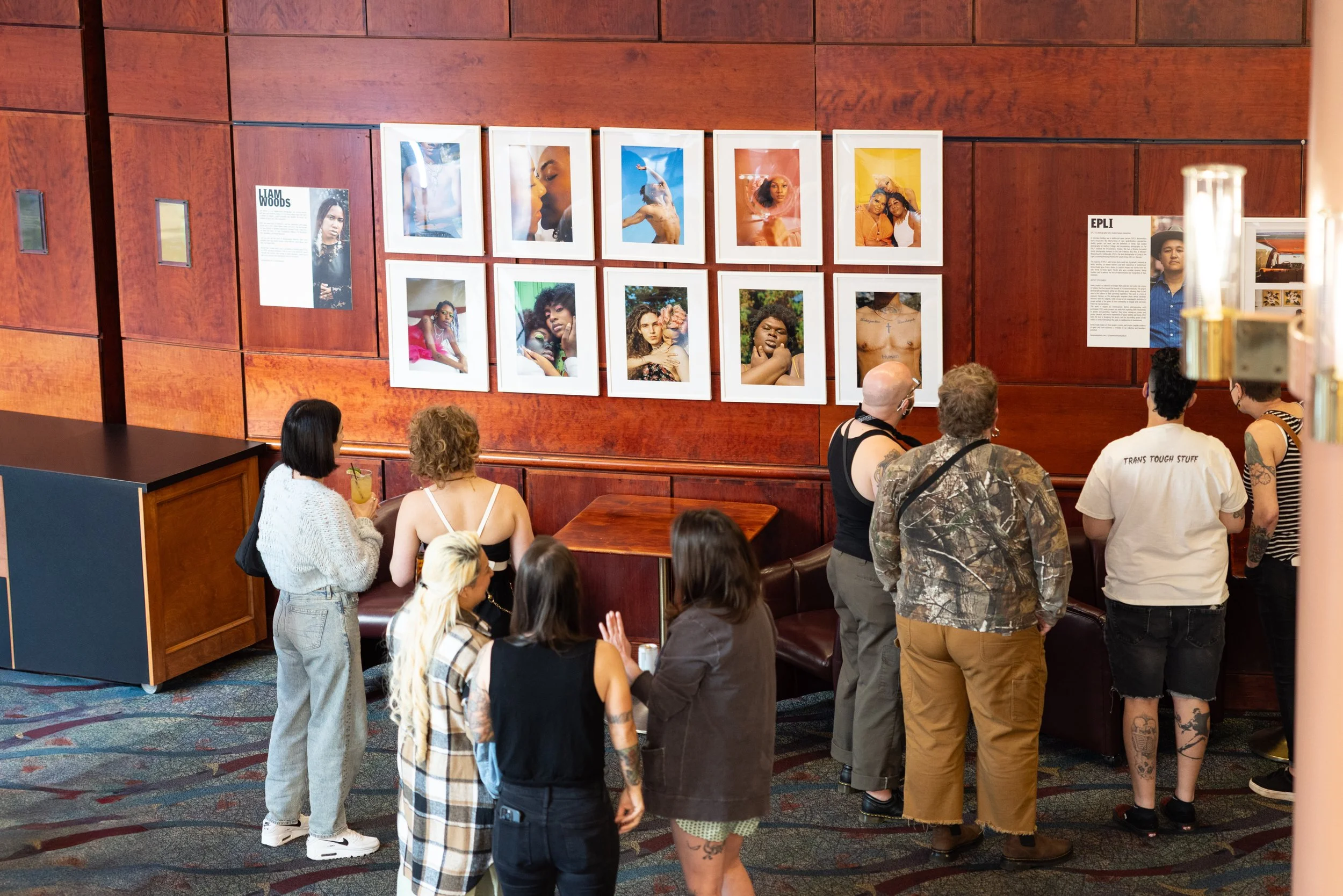 Crowd looking at exhibition art at Framing Our Presence event at Portland 5 Winningstad Theater in Portland, Oregon. Event Photography bu JP Bogan.