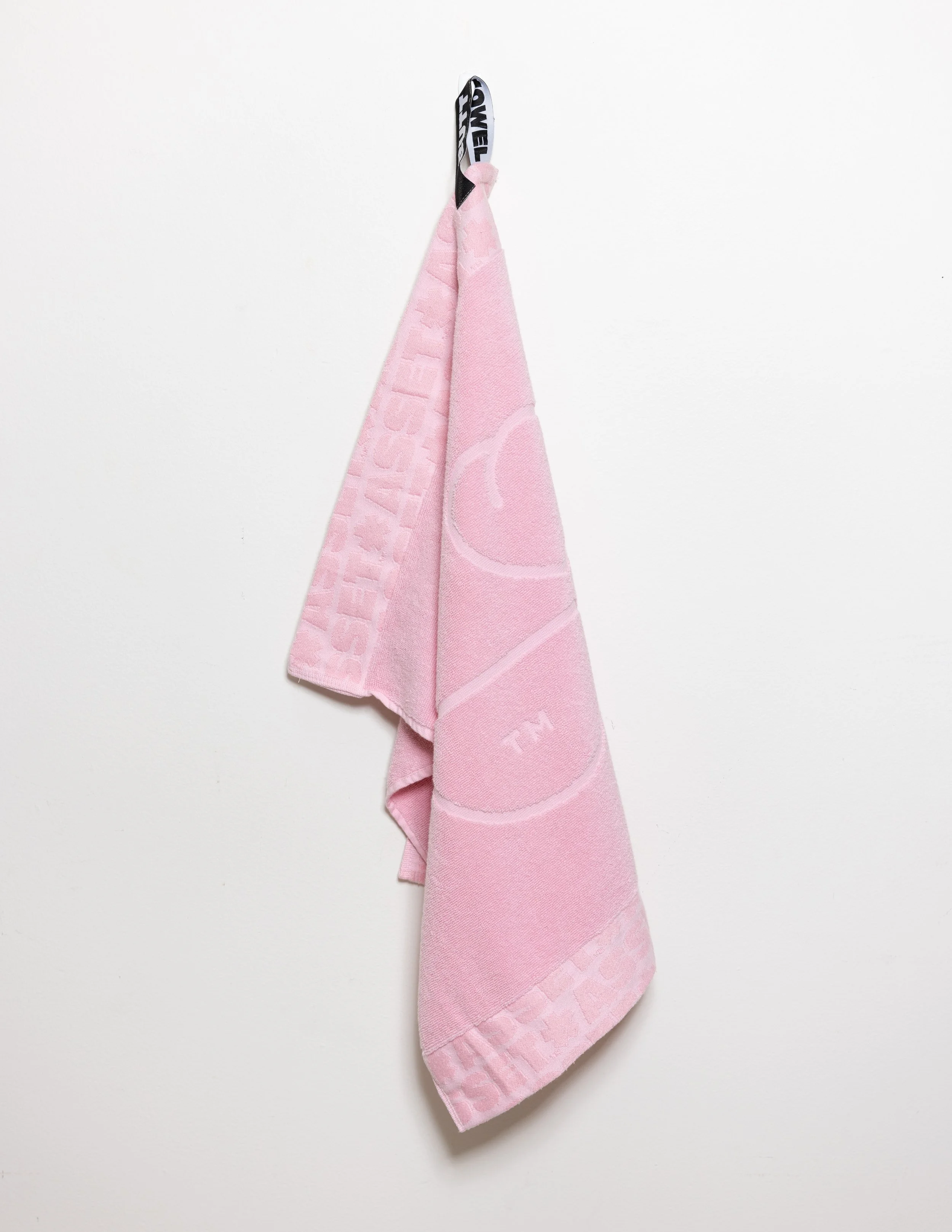 Pink hand towel product photography in a studio by Portland, Oregon product photographer, JP Bogan. PDX Product Photography at SumSum Productions studio.