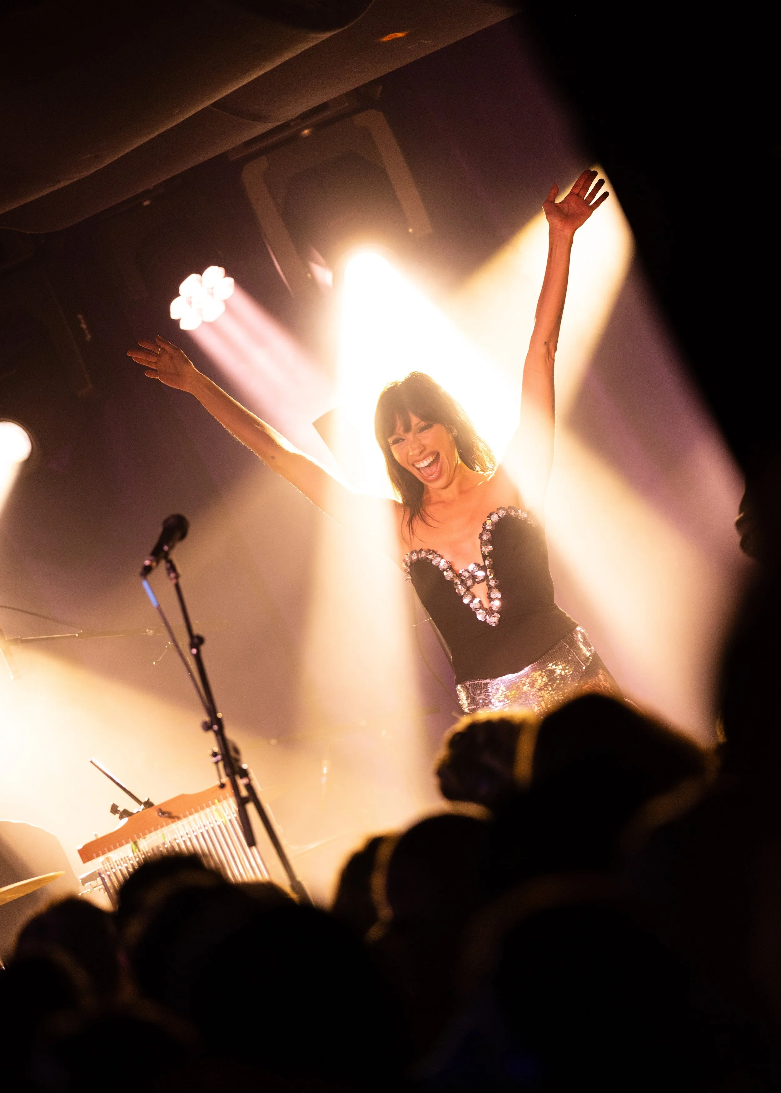 Concert Photography of Syd Taylor basking in the light at her performance at The Get Down music venue in Portland, OR. 