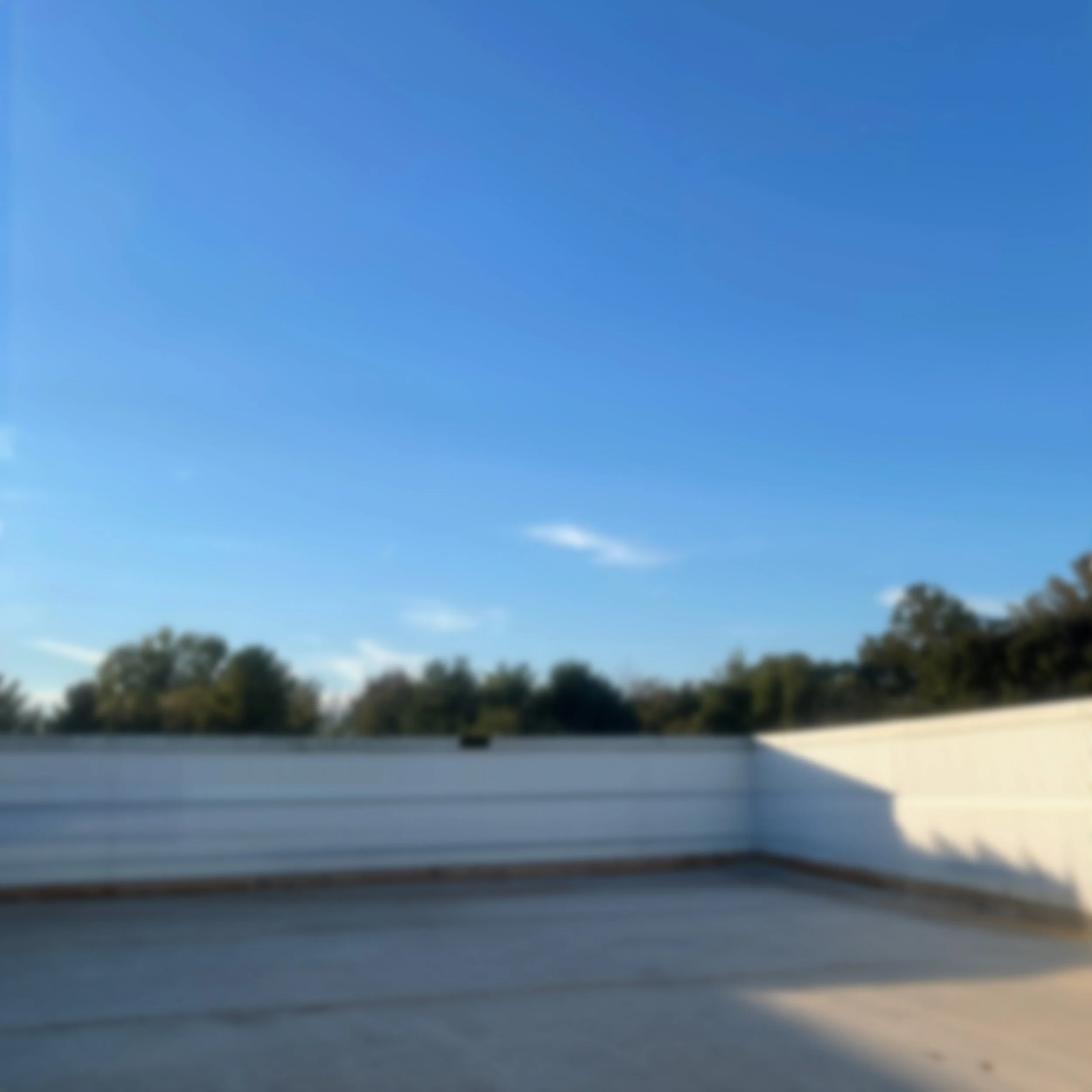 Commercial building rooftop where an HVAC unit is being installed