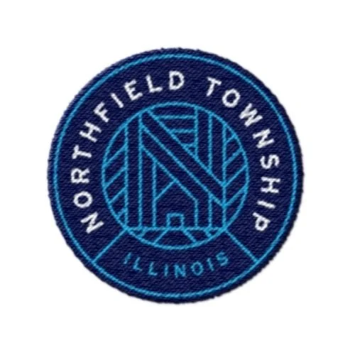 Embroidered patch with a circular design, featuring the text 'Northfield Township Illinois' around the border and a stylized abstract logo in the center.