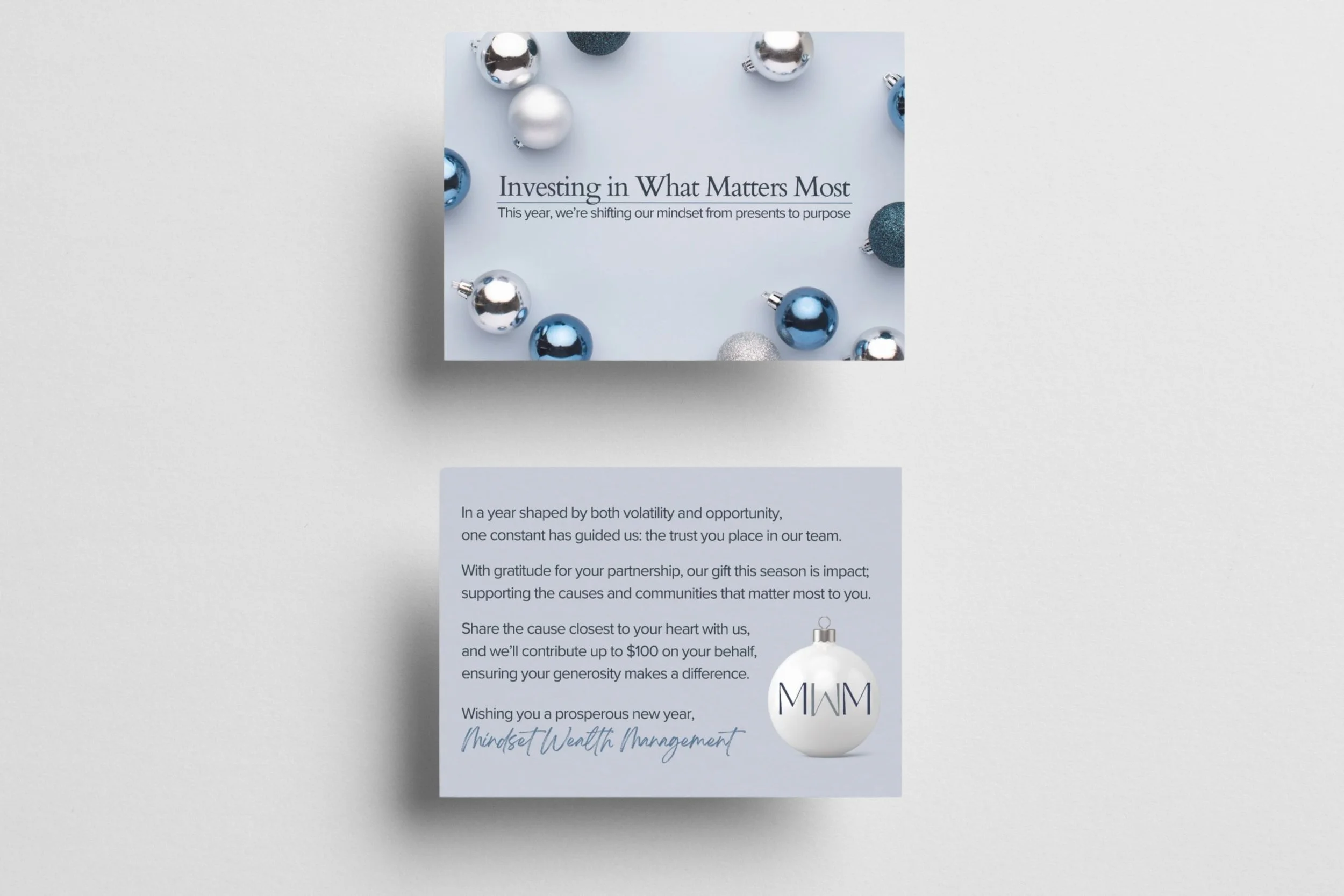 Field Day Designs holiday card for a financial brand featuring minimalist layout, silver‑and‑blue ornaments, and messaging centered on gratitude, purpose, and community impact.