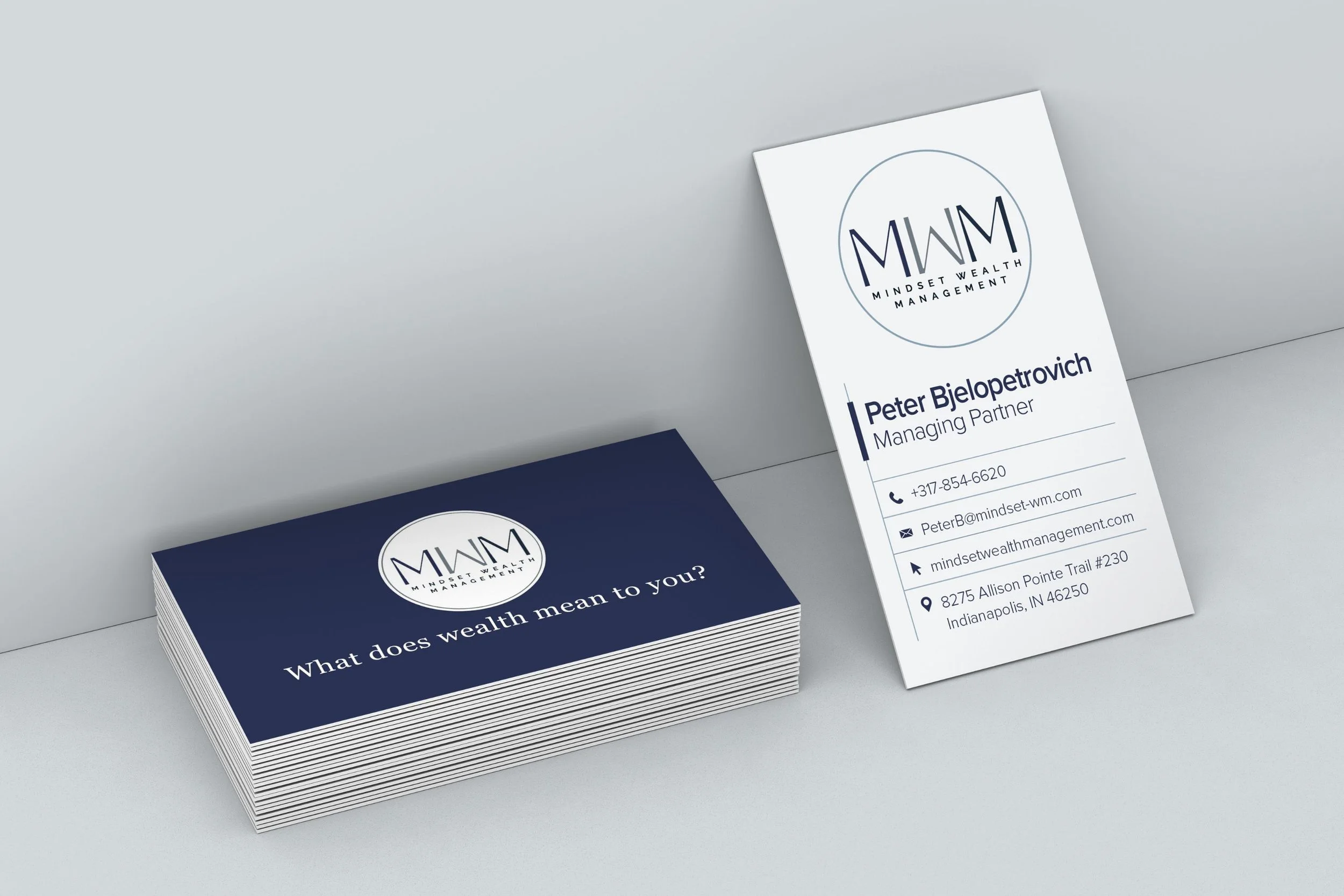 Field Day Designs business card set for a financial services firm featuring modern typography, navy‑and‑white palette, and intentional design that communicates clarity, trust, and professionalism.