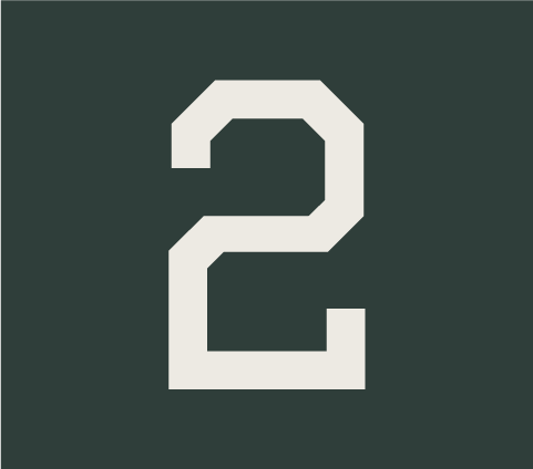 White number two on a dark green background. Field Day Designs brand elements featuring clean typography, balanced composition, and intentional design that reflect clarity, confidence, and collaborative c