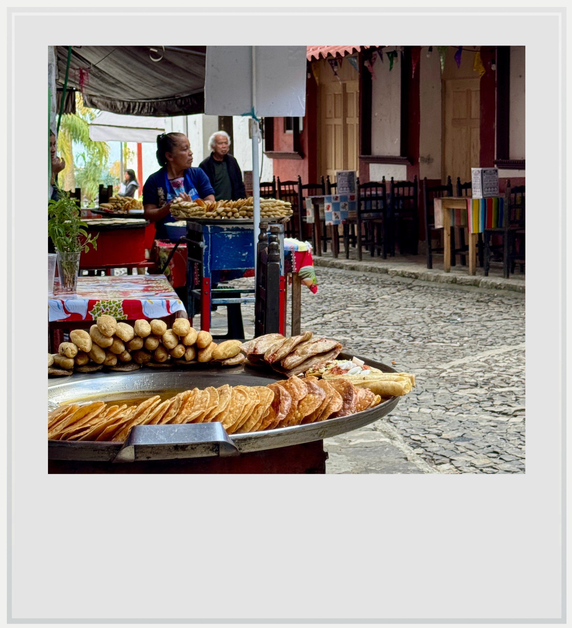 Tlayoyos and other delicacies on a small street of Cuetzalan, Puebla, Mexico.