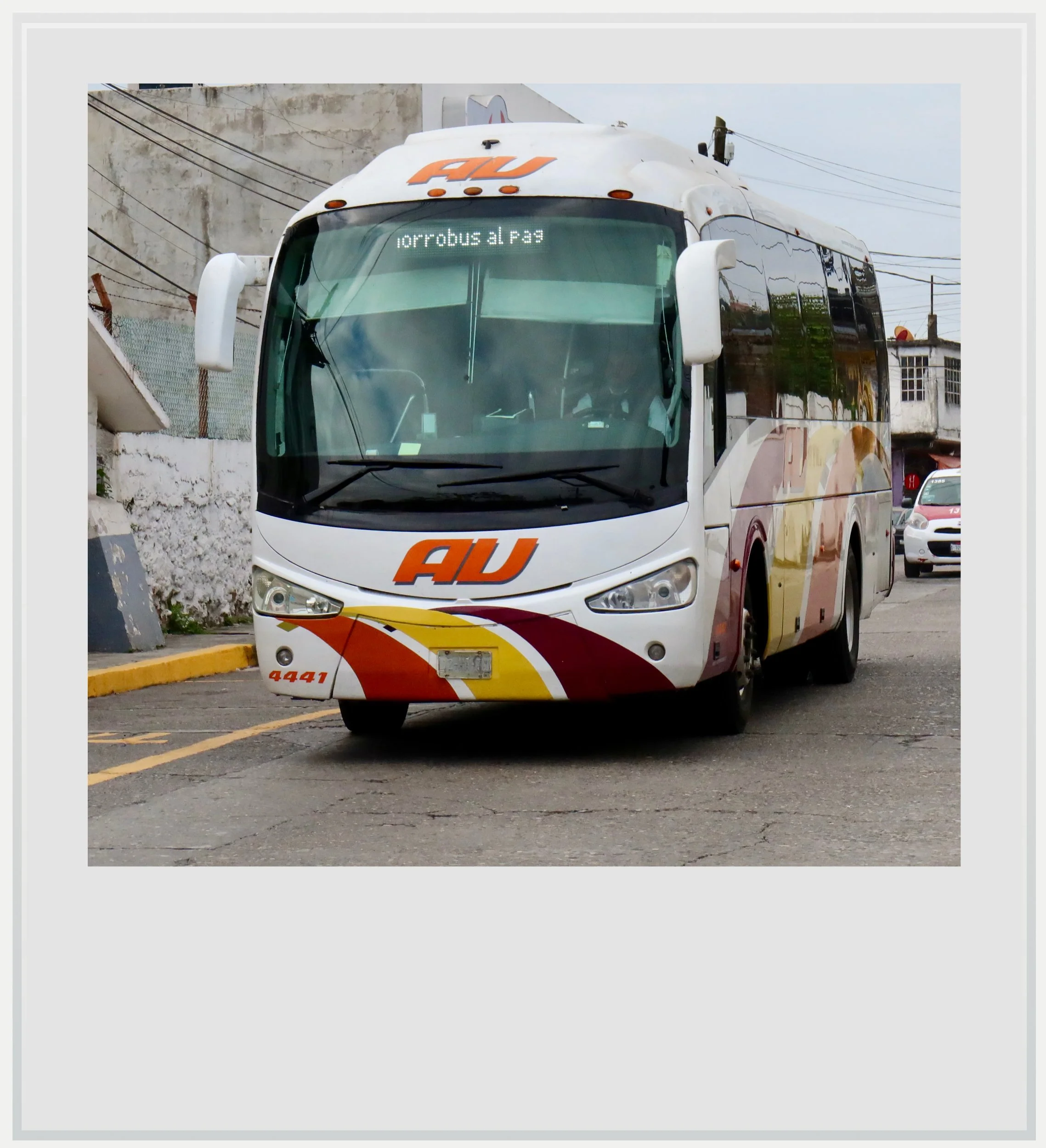 A second-class bus from AU, the economy brand of the ADO group.