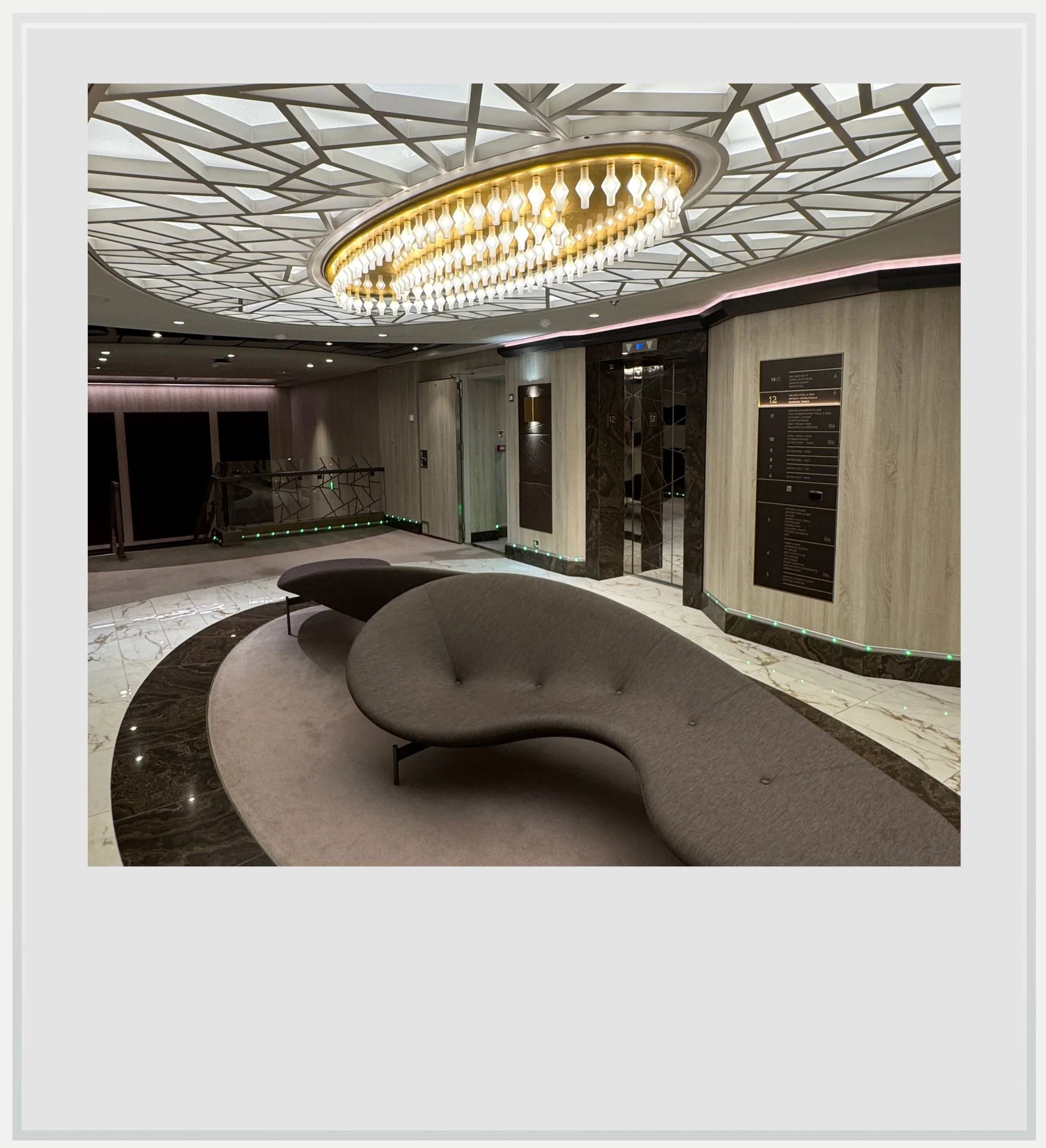 The front elevator lobby on the Explora I ship.