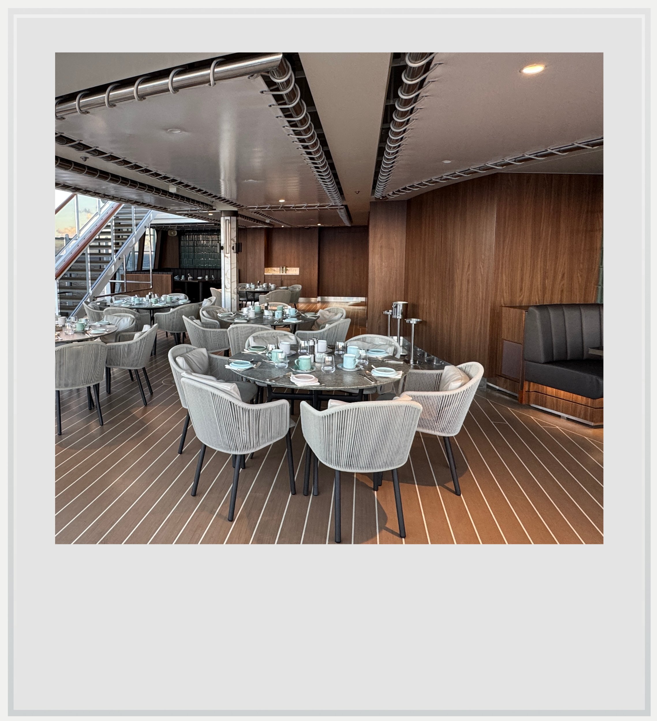 The outside seating area of the Emporium, at the back of deck 11 on Explora I.
