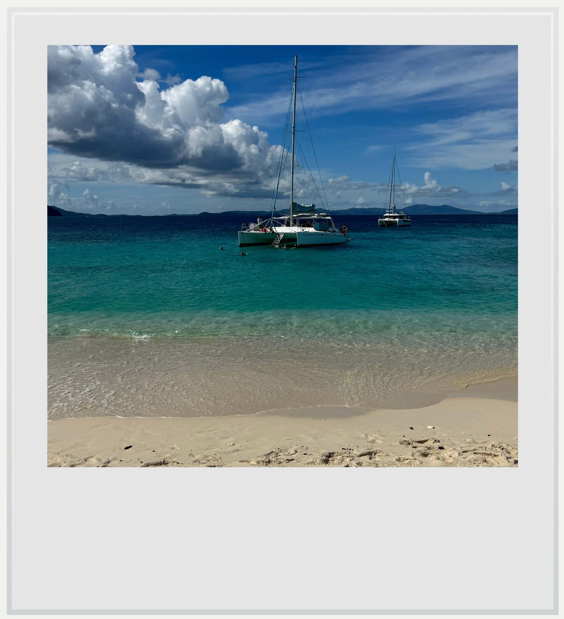 Our catamaran from the beach at Sandy Cay near Tortola, BVI.