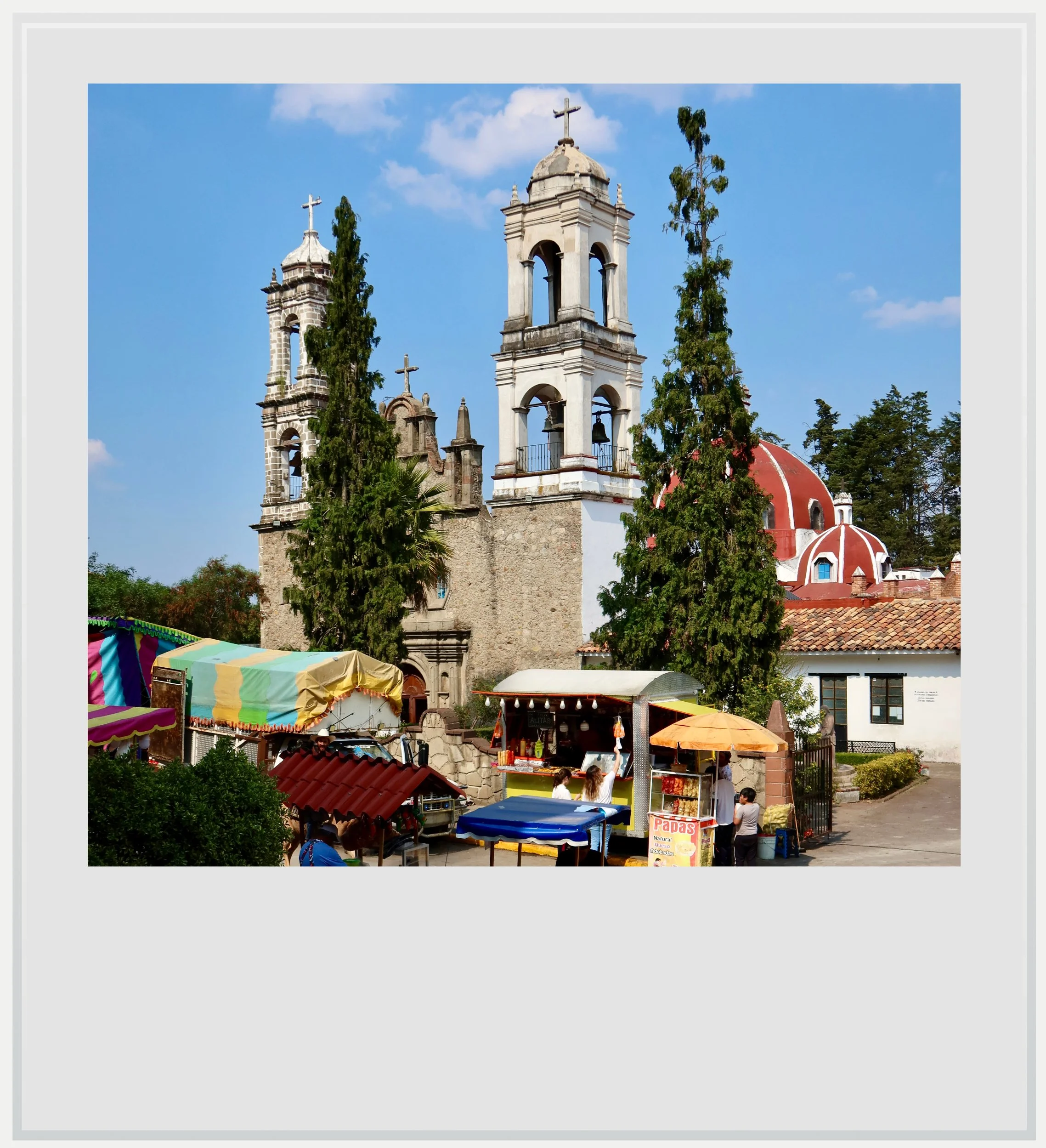 Santa María de la Peña de Francia church, with the town fair in full swing, in Villa del Carbon, Mexico.