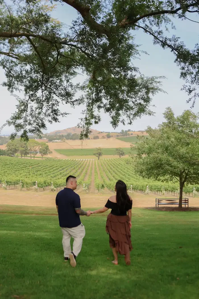 couple walking in winery