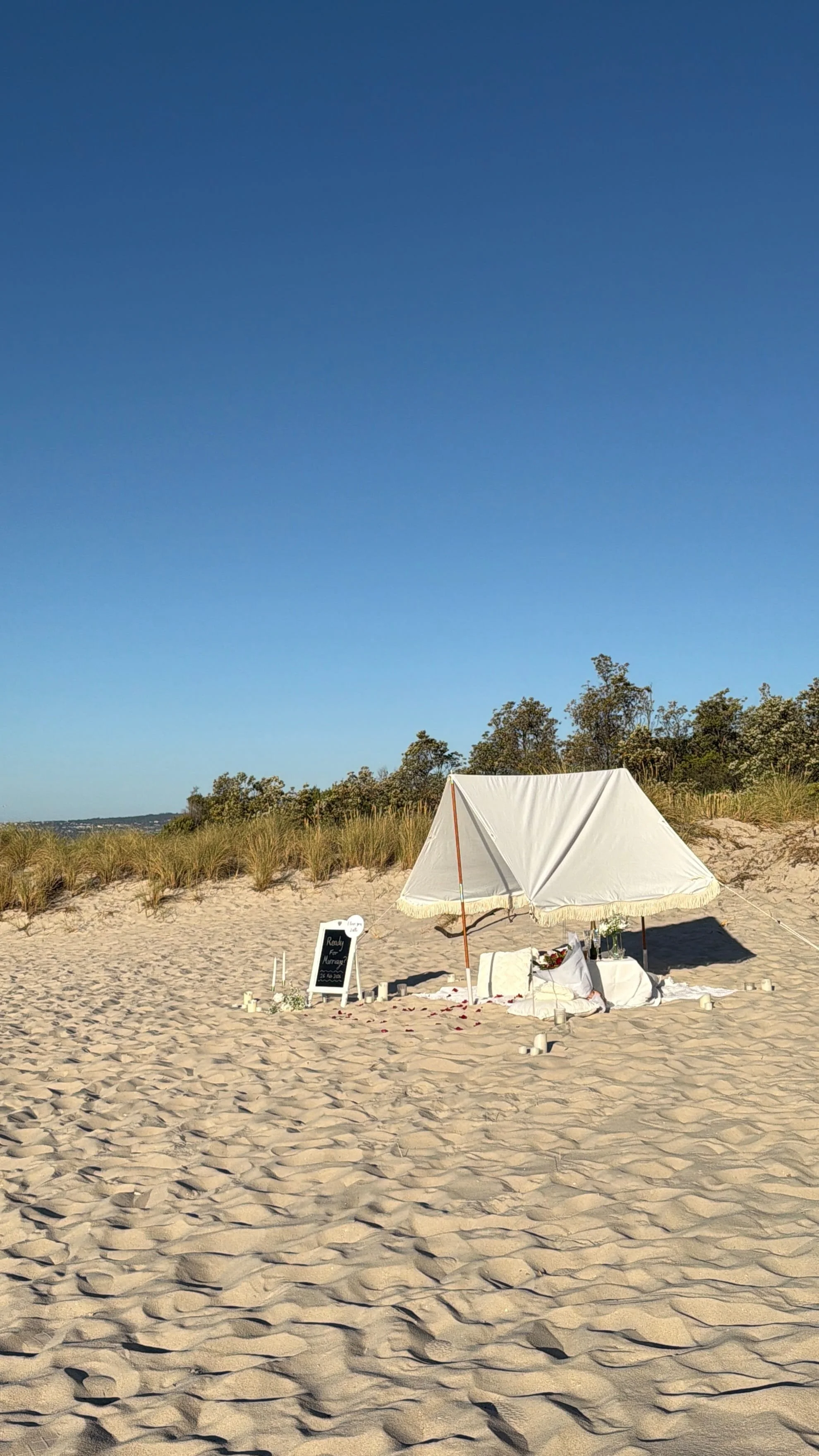 teepee set up on the beach for a proposal