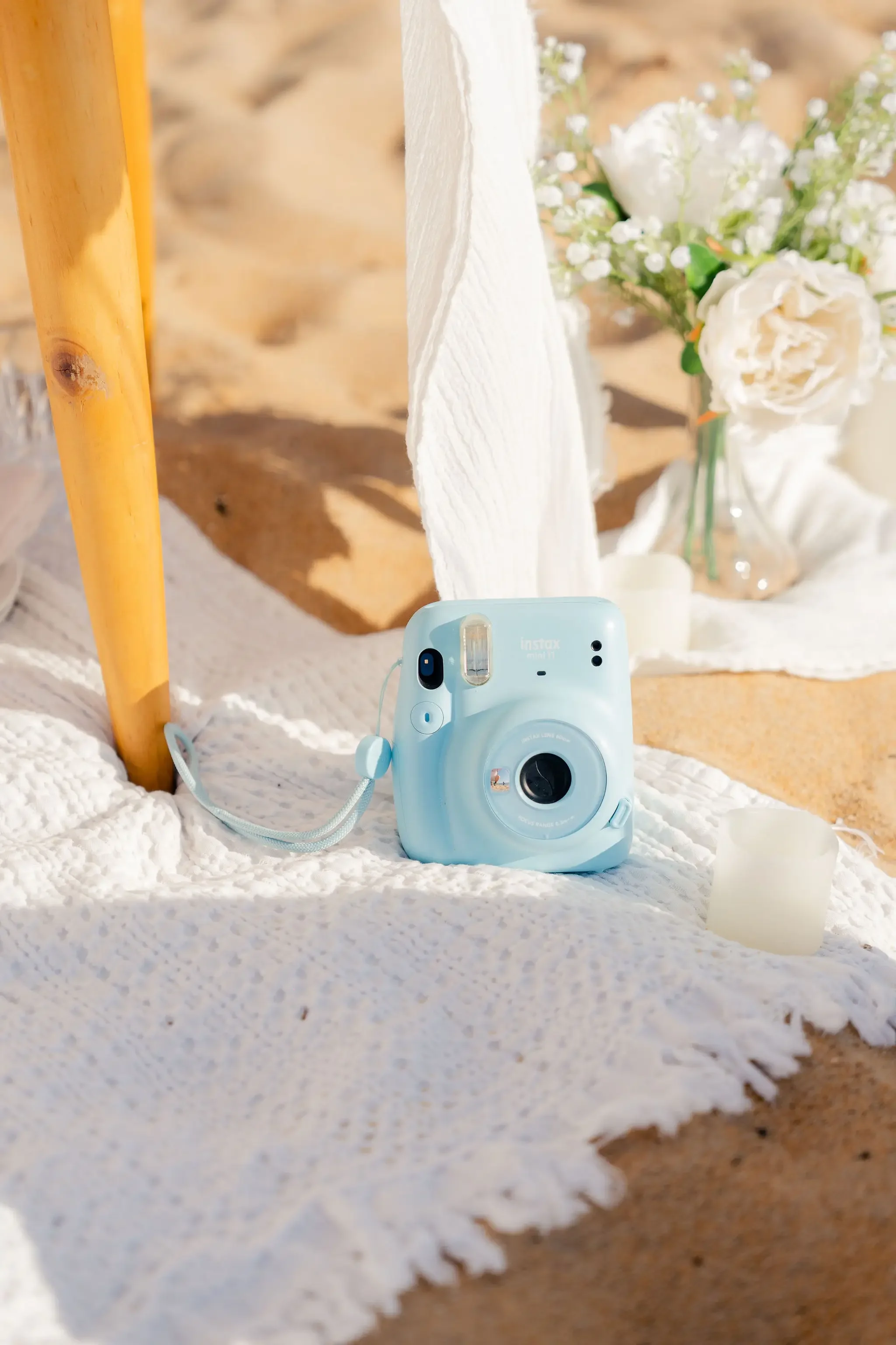 polaroid camera on beach for proposal