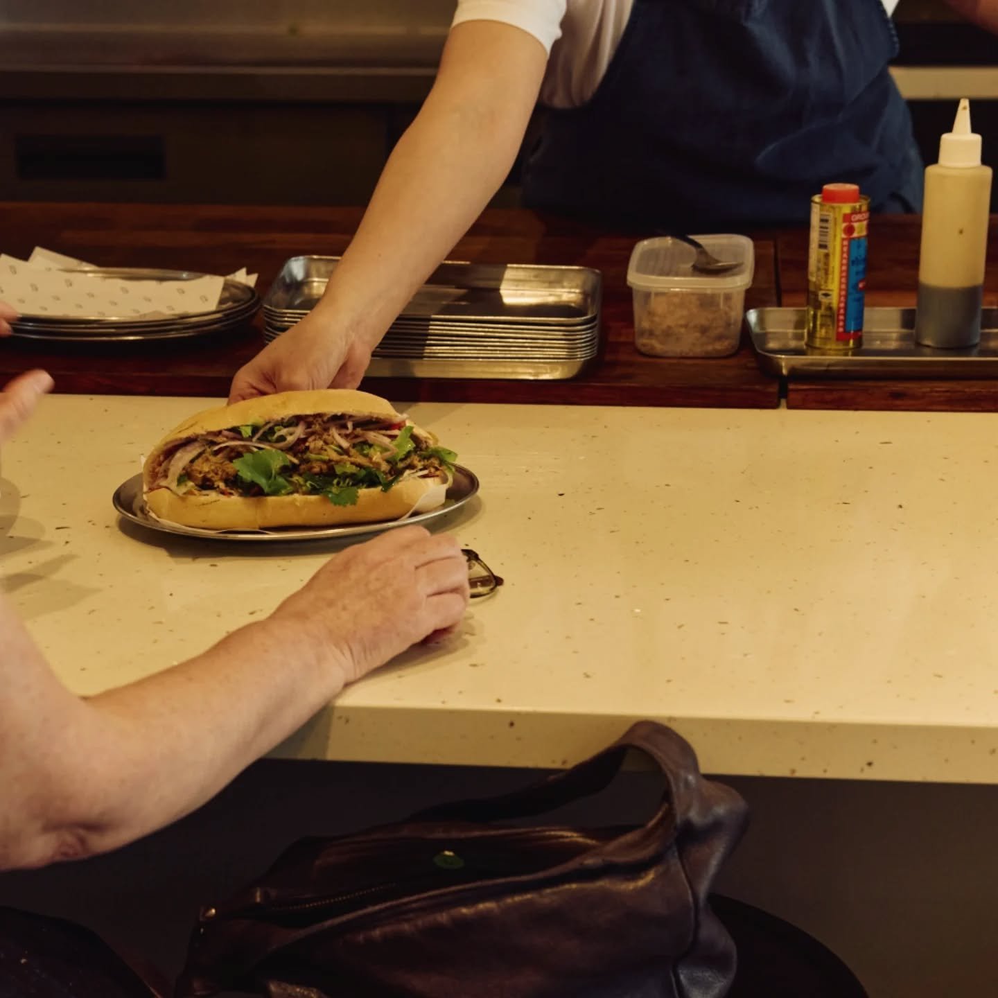 Cooking over fire...the most basic form of cooking there  is. Our Lao sausage and our turmeric chicken are ones that meet the flame directly for the heat and char 🔥 and the loaves of bread themselves