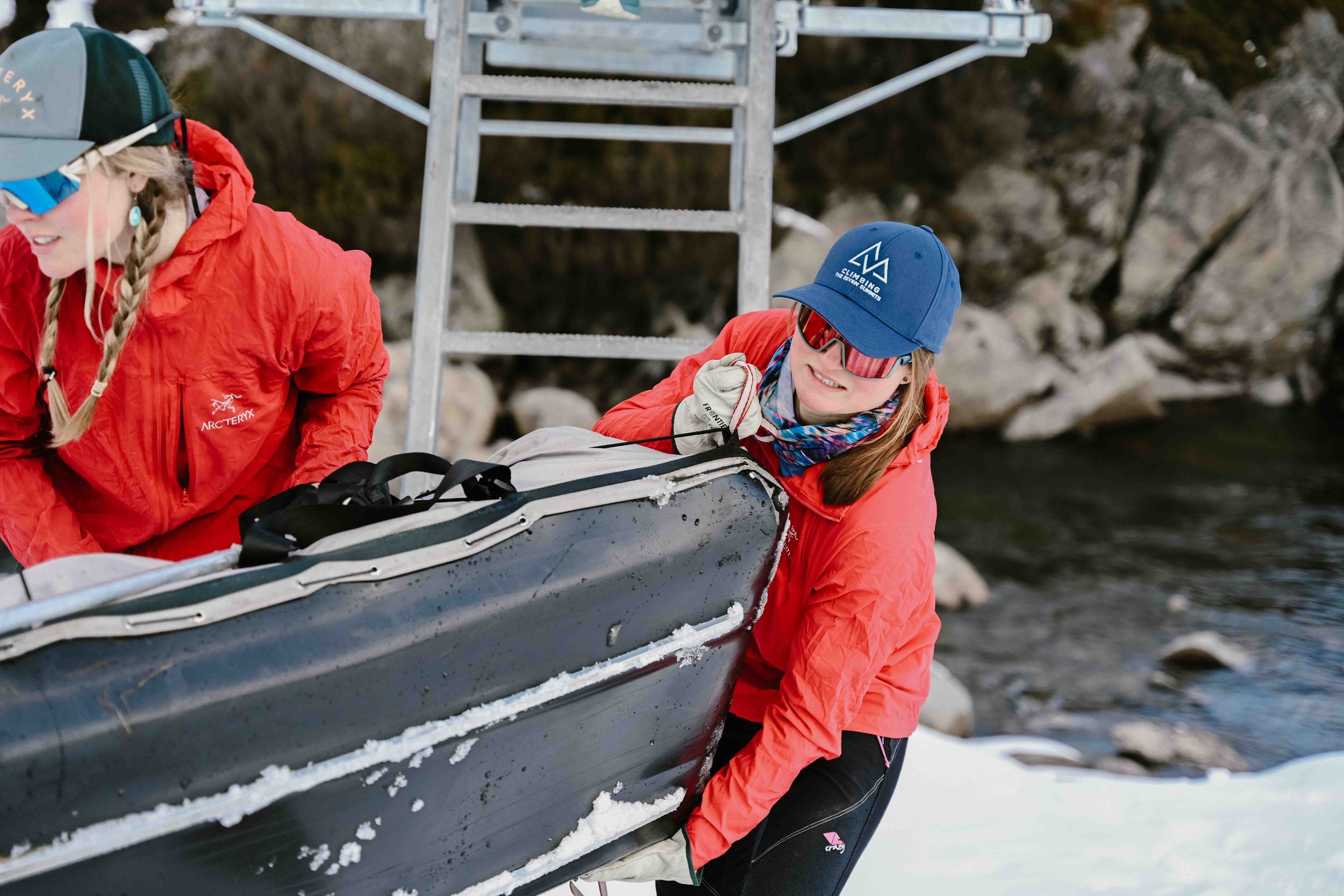 Ange Malysheva & Imogen Lewins haul a sled with camera gear across the Illawong bridge. Photographer: Leah Foster.