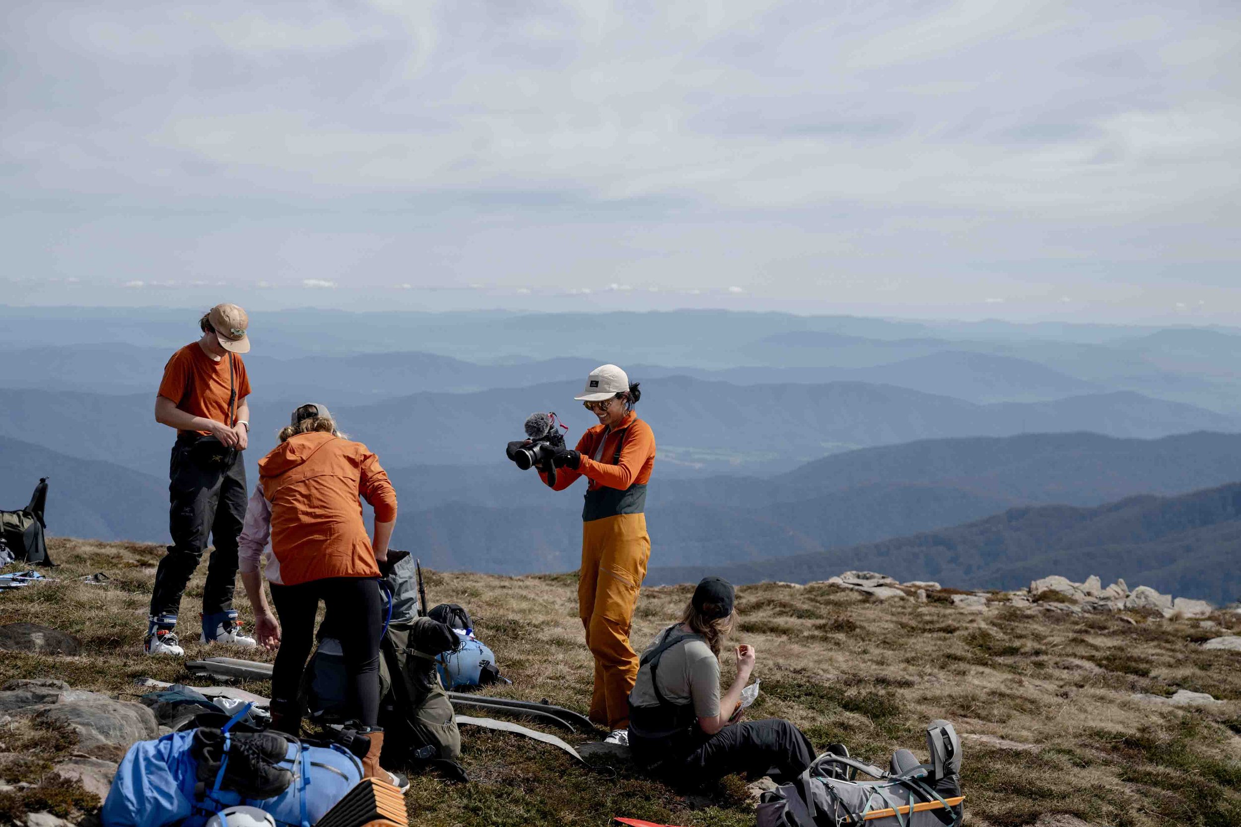 Divya Gordon shoots Leah Foster atop the Watsons crags during the Opera House Hut mission. Also seen in shot, Chess Smee and Kate Donald. Photographer: Aaron Dickfos.
