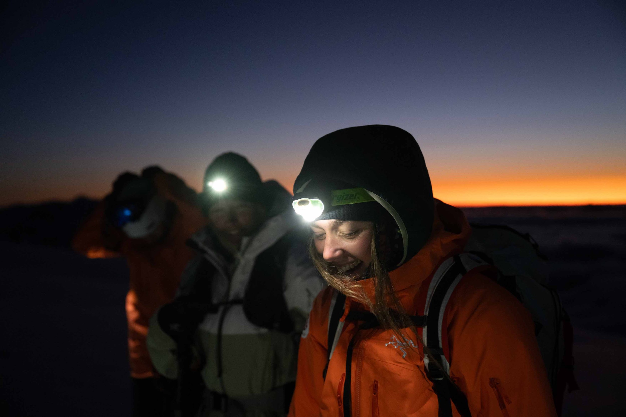 Mimi Gee and Alex Parsons on their way back to camp from Tenison Woods Knoll at sunset. Photographer: Divya Gordon