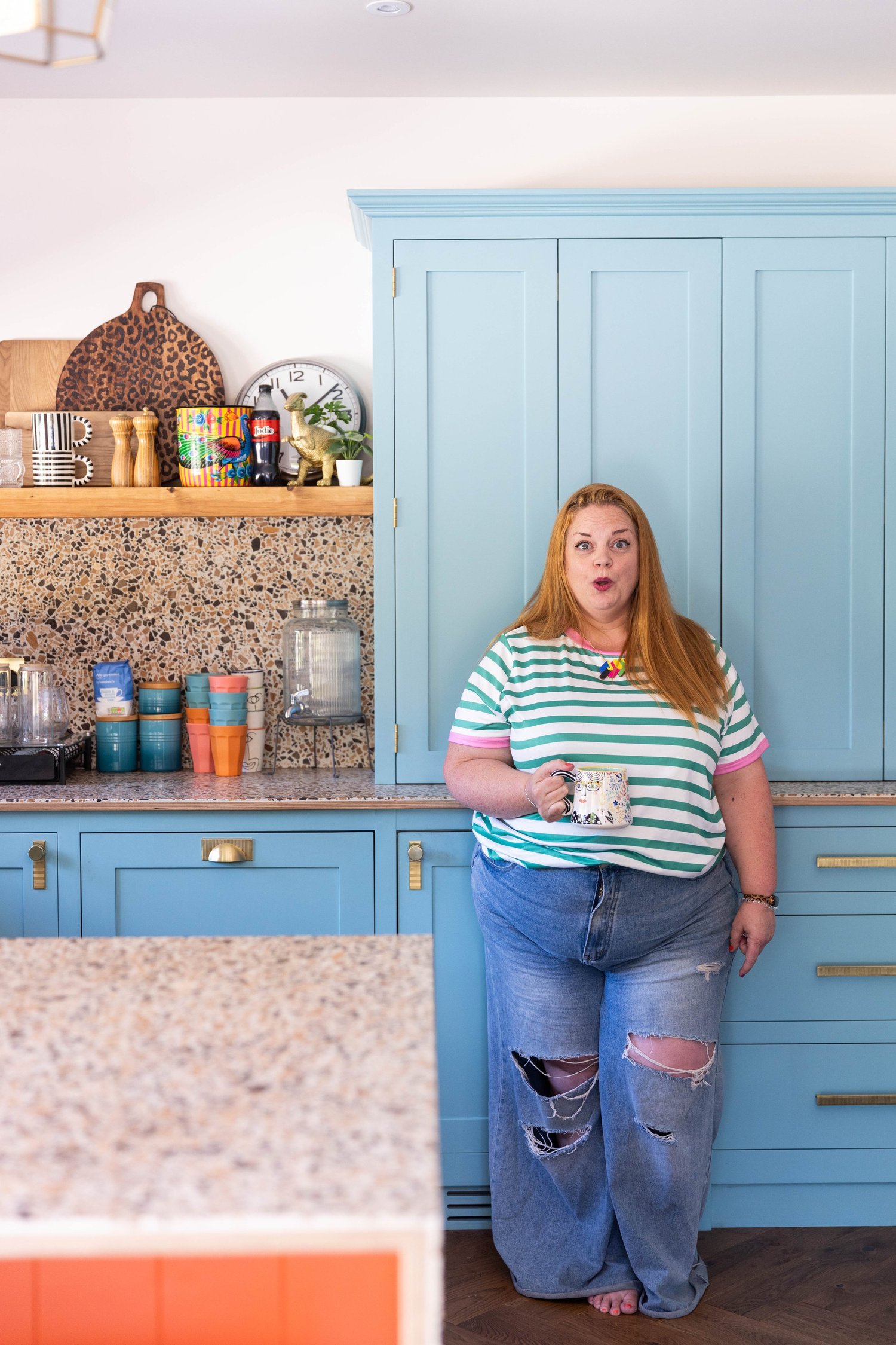 Jodie, surface pattern designer behind Colour Rebel, surrounded by her bold surface pattern designs