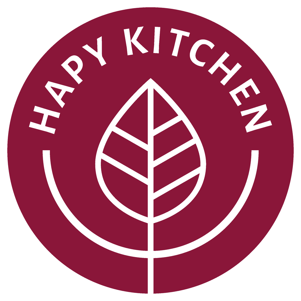 Maroon circular logo with white outline and text that reads 'Happy Kitchen' around a stylized leaf in the center.