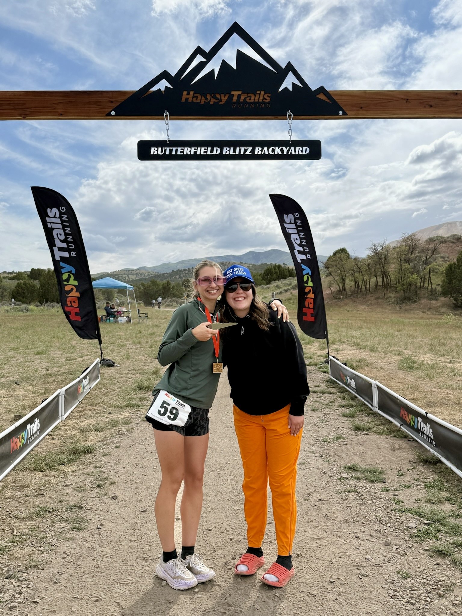 Andrea and Sara Mo, the Girl Get After It Salt Lake City Community Leads, at a trail race finish line