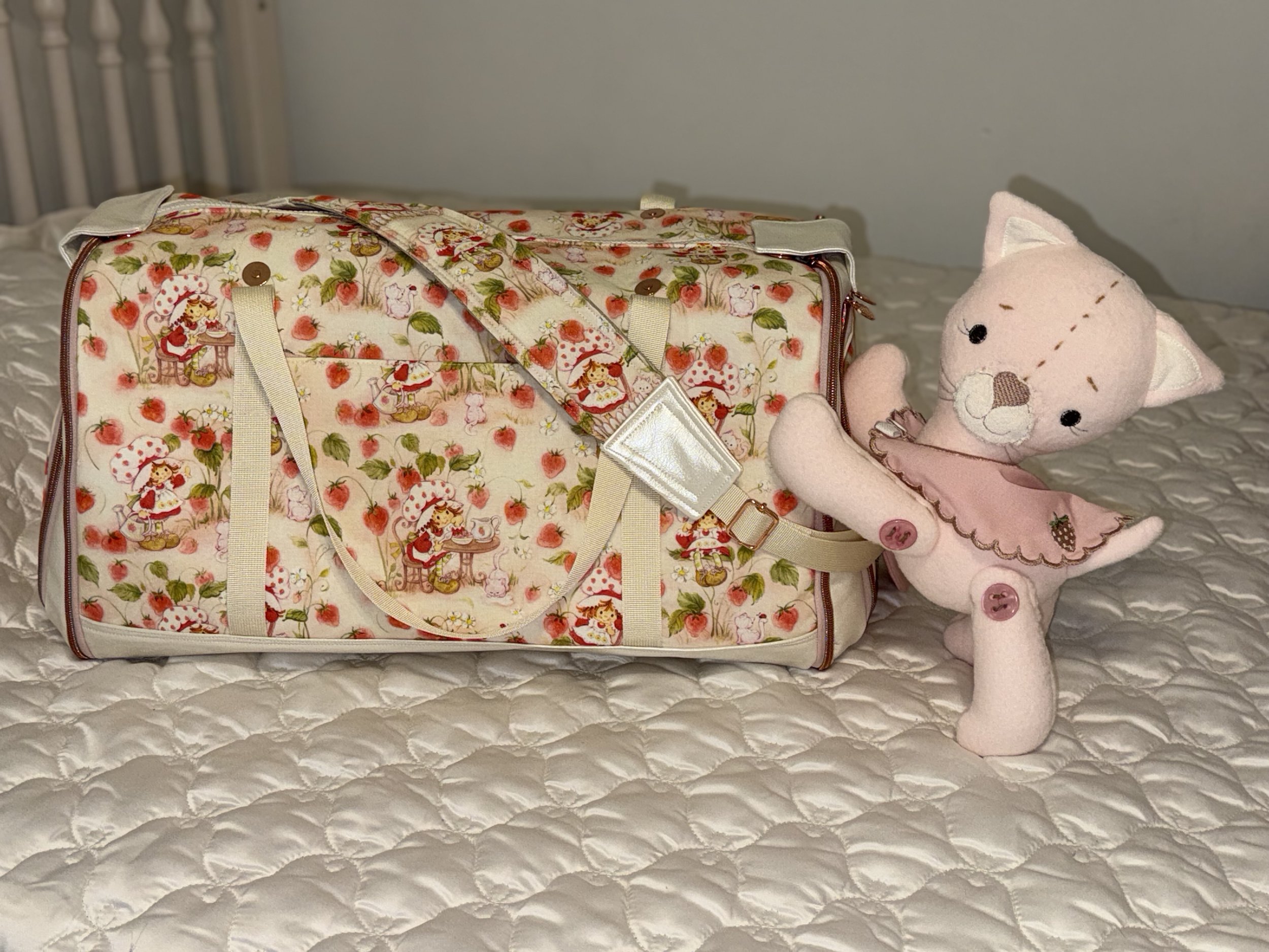 Berry sweet Lullabye luxe travel tote bag with matching Removable travel Bassinet.