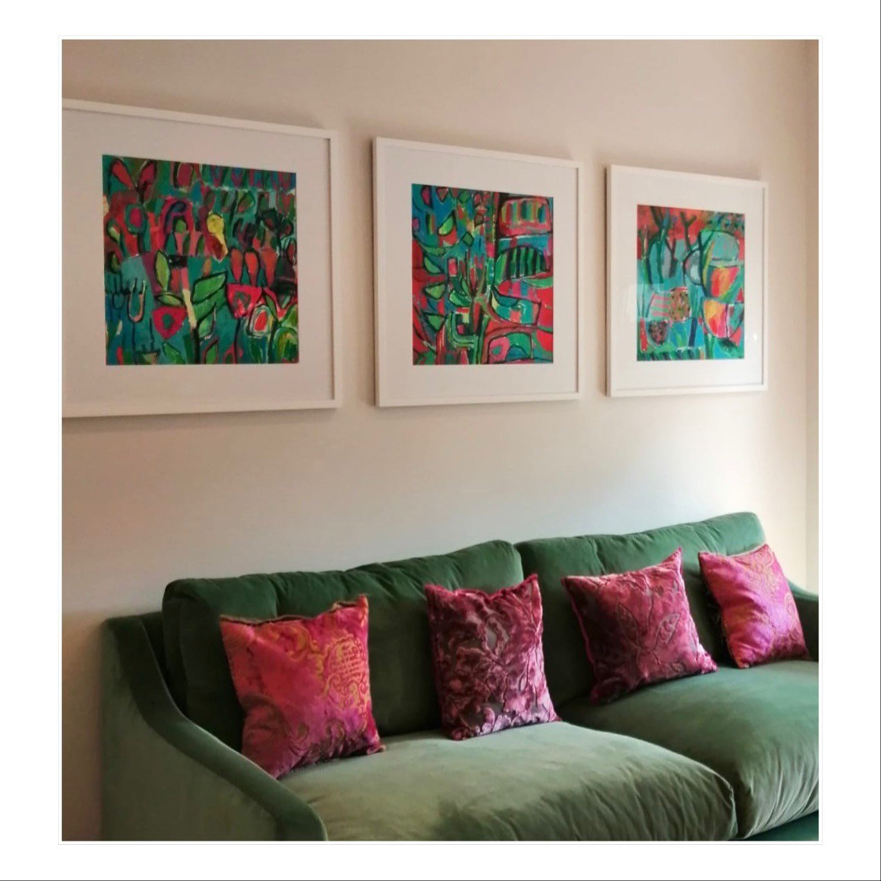Three framed paintings by Liz Foster hanging in a collectors home 
